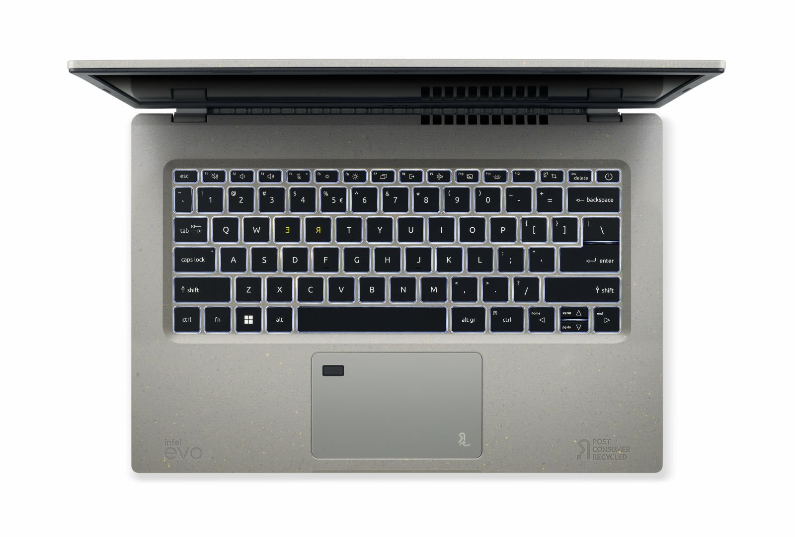 Laptop pokazujący klawiaturę i gładzik. Klawiatura jest podświetlana, a laptop jest otwarty.