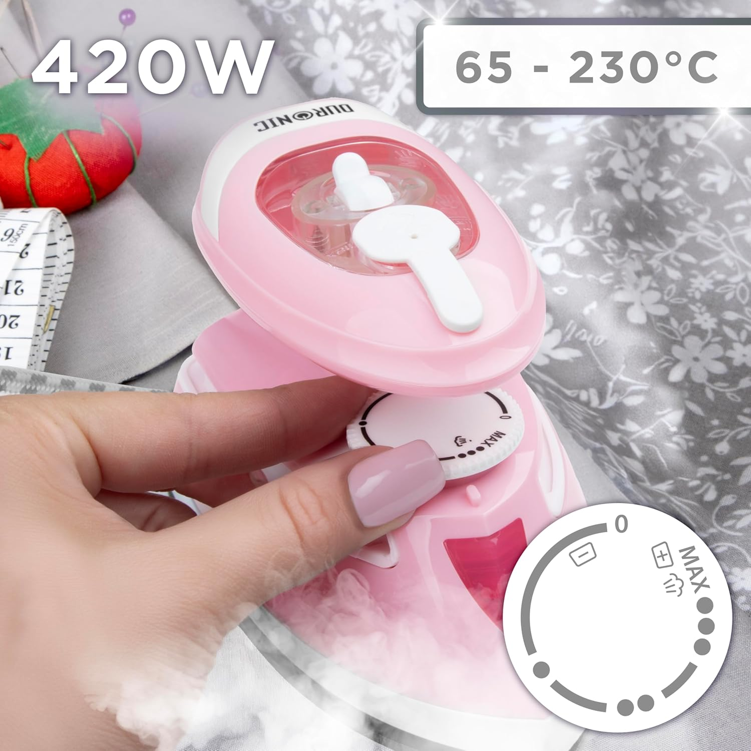 Pinkes Bügeleisen mit Drehregler und Dampf, Text zeigt 420W und Temperaturbereich.