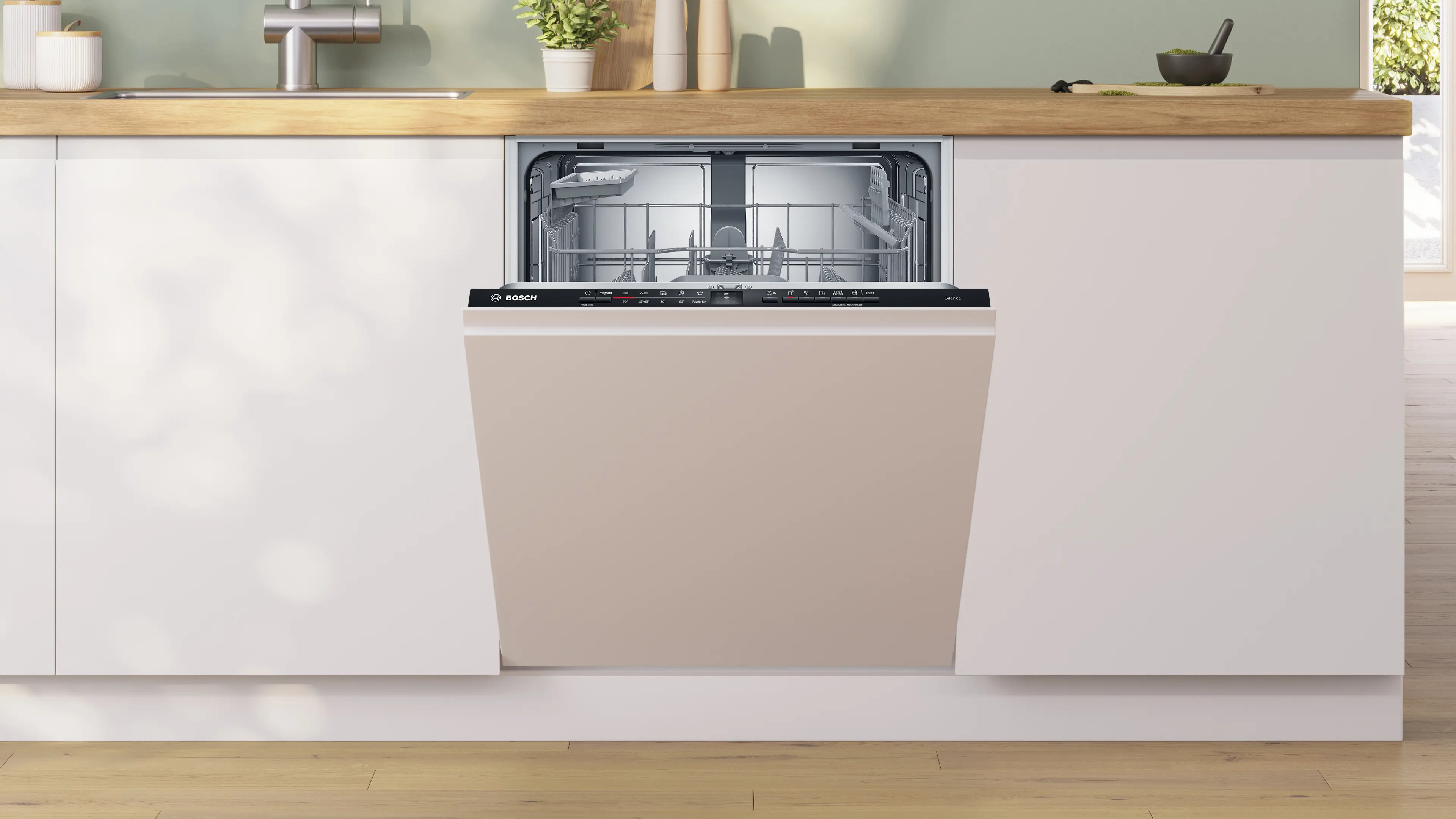 Bosch vaatwasser, deur gesloten. Beige deurpaneel, geïntegreerd in keukenkasten. Keukenomgeving.