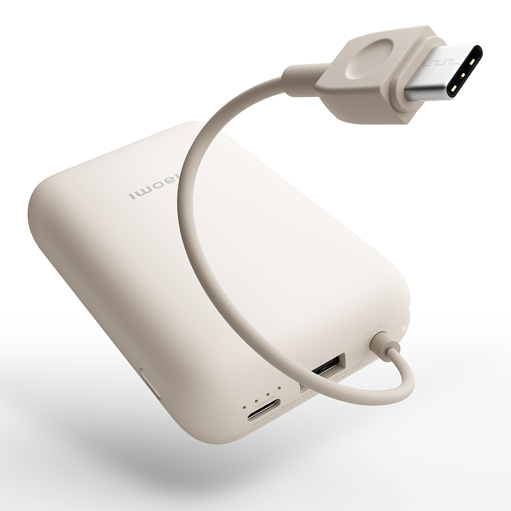 Biały power bank z kablem i wtyczką USB-C.