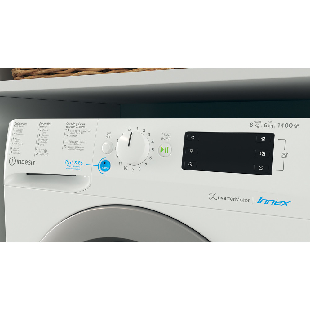 Panel de control de lavadora Indesit blanco con botones y un dial.