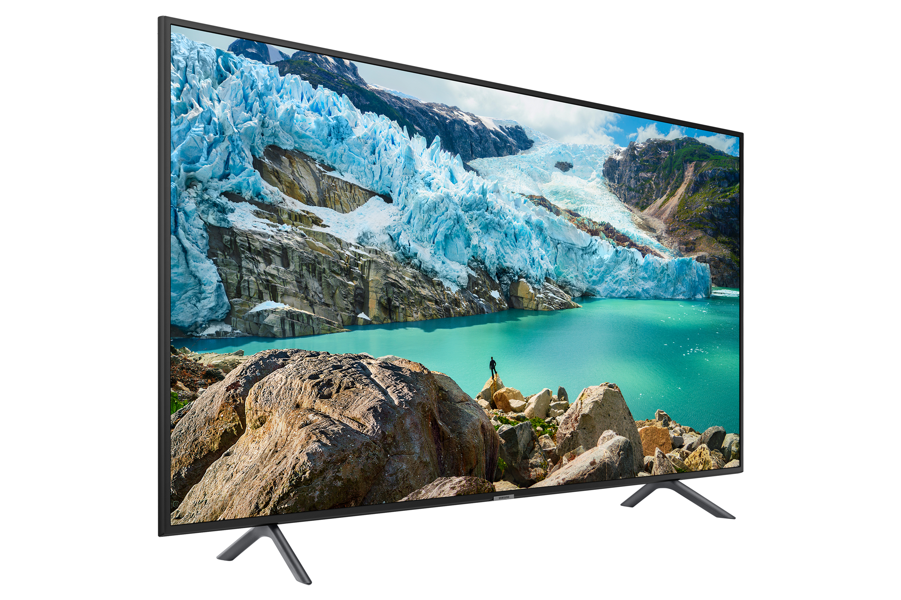 Un TV mostra un paesaggio glaciale con acqua turchese, rive rocciose e una montagna.
