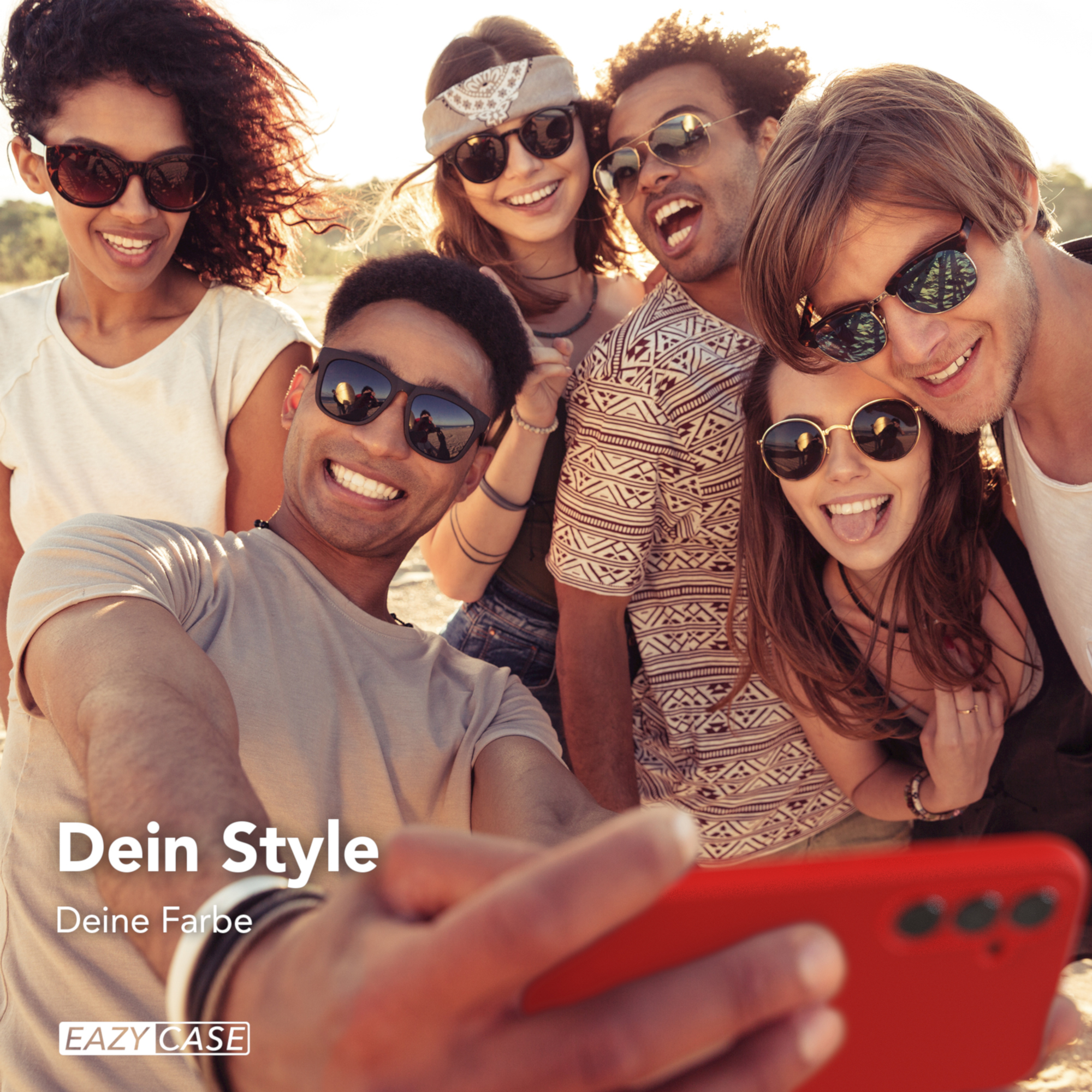 Gruppe von Menschen, die ein Selfie mit einem roten Telefon machen, Sonnenbrillen tragen und lächeln.