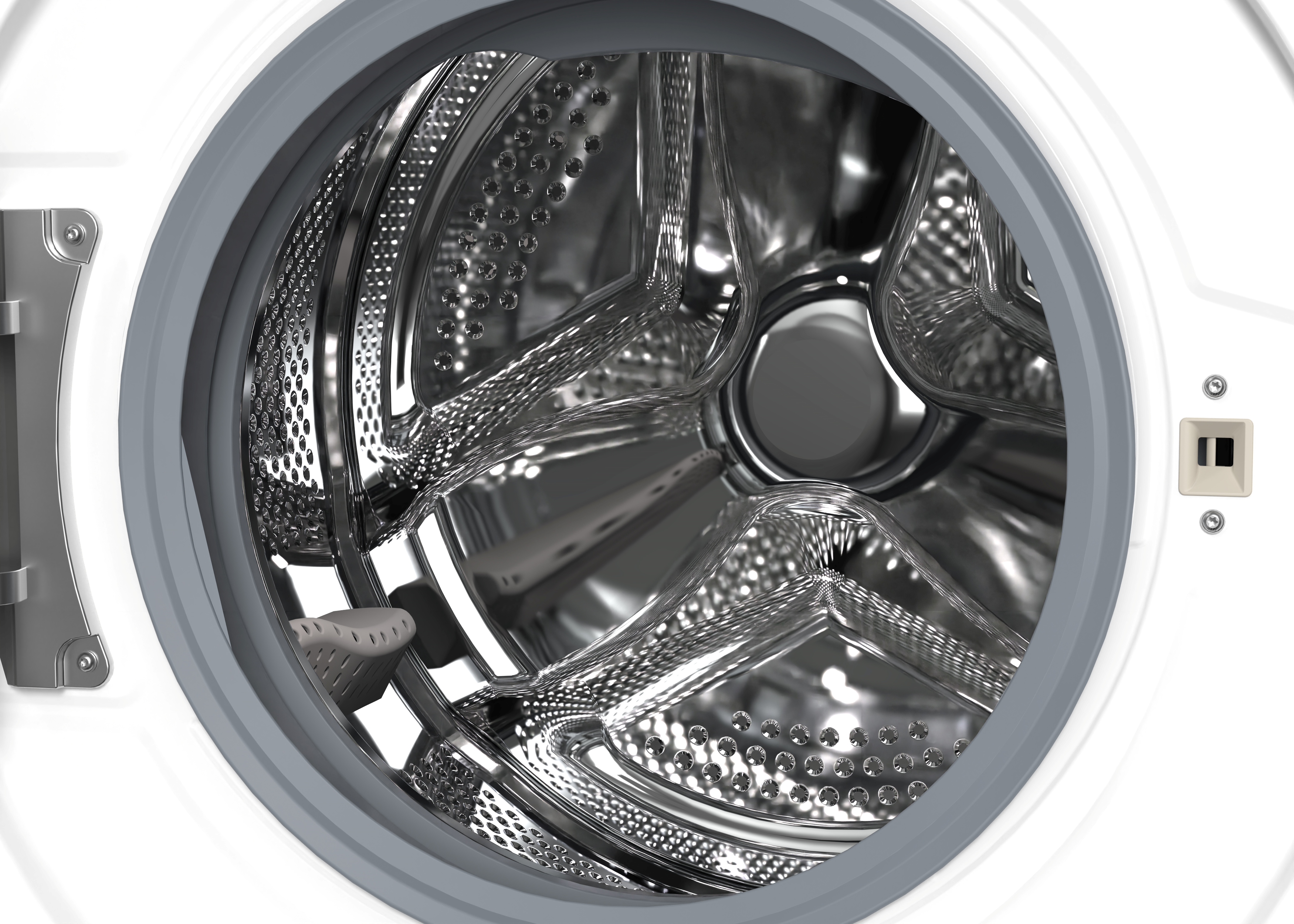 A close-up view inside a washing machine drum, showing the stainless steel interior.