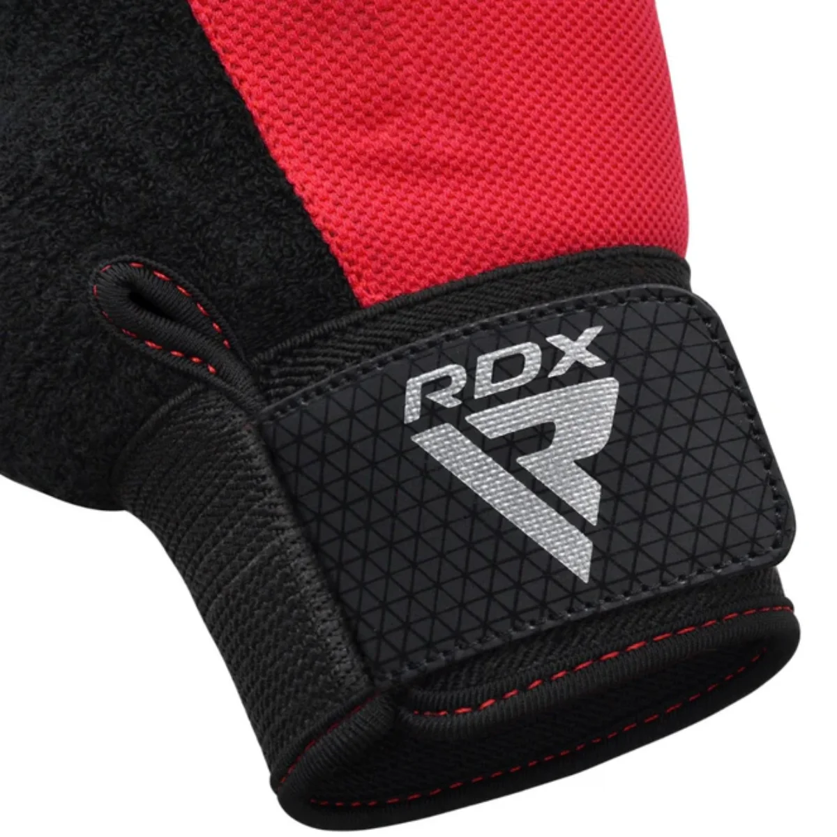 Close-up of a black and red RDX glove, showing the RDX logo and wrist strap.