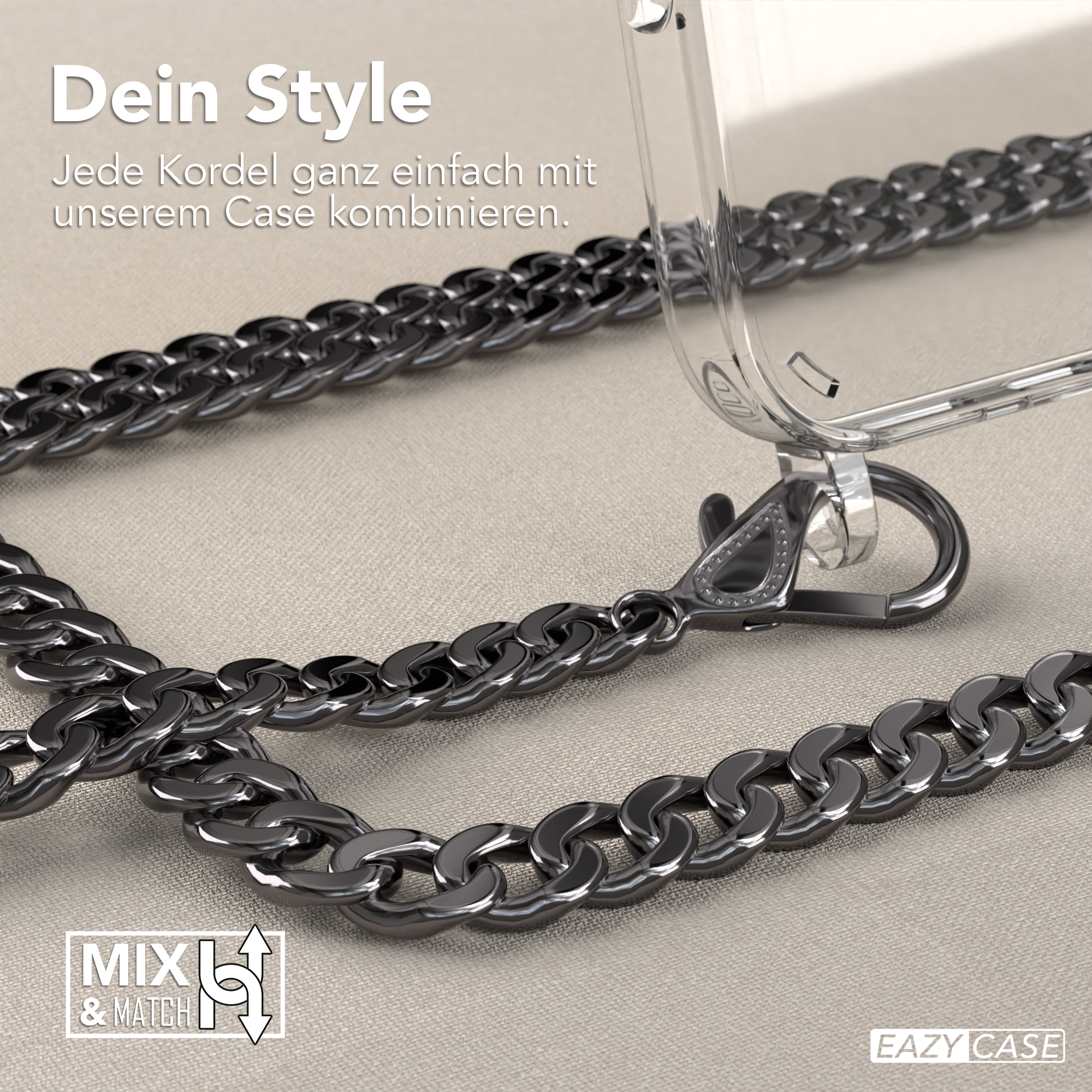 Handyhülle mit Kette. Schwarze Kette und silberner Verschluss. Auf beiger Stoffoberfläche.