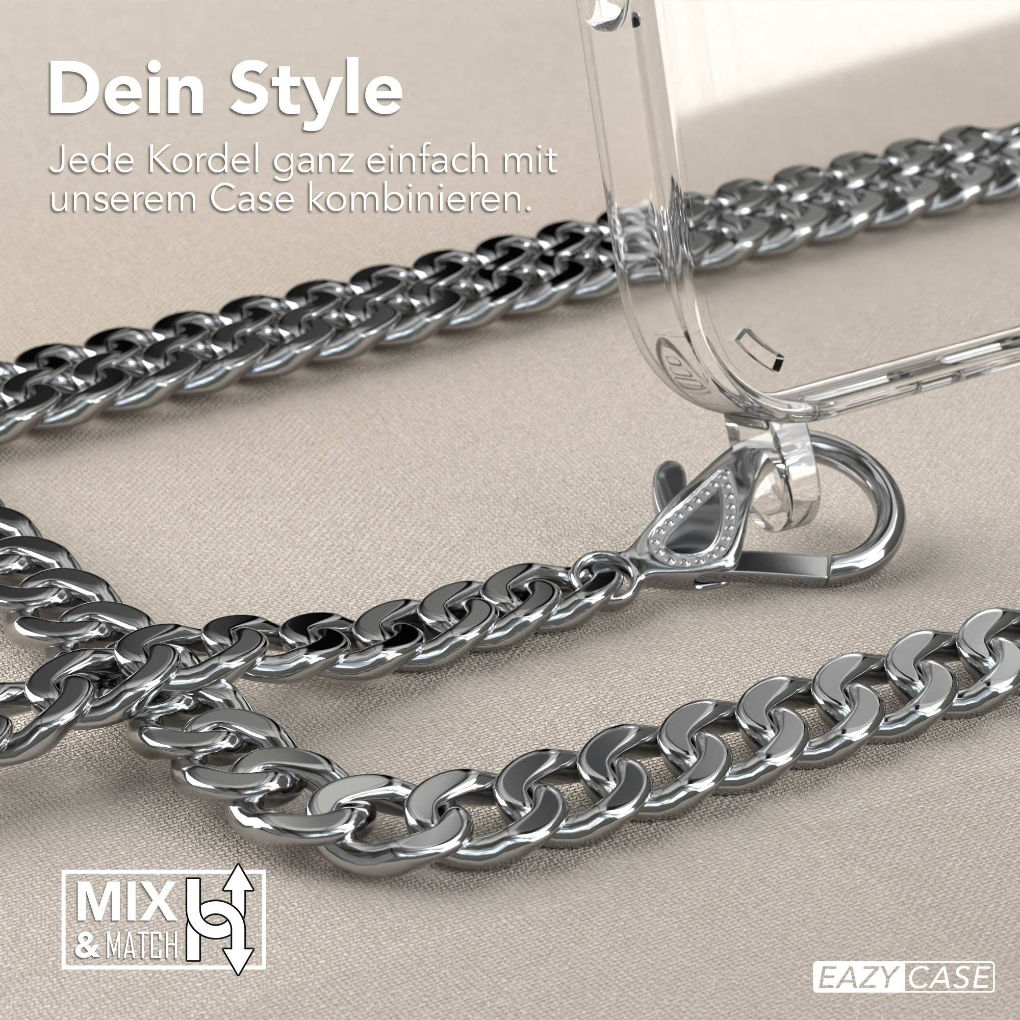 Silberkette mit Handyhülle auf Stoffoberfläche.