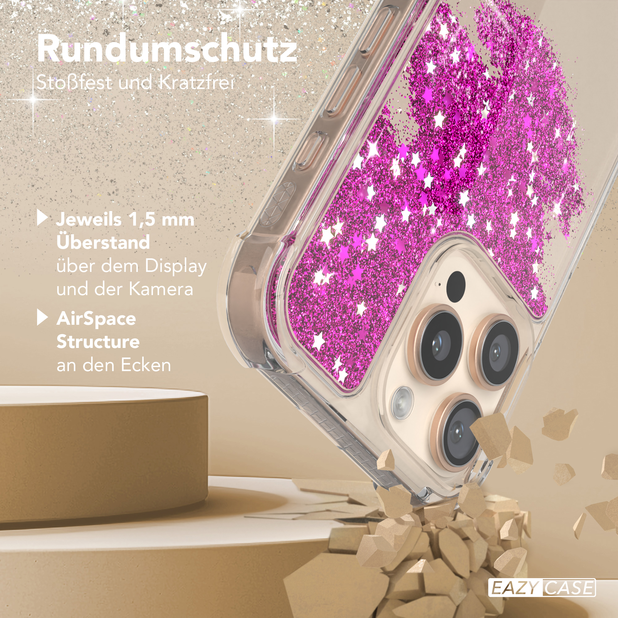 Eine Handyhülle mit pinkfarbenem Glitzer und Sternen. Die Hülle liegt auf einer Oberfläche mit zerbrochenen Teilen.