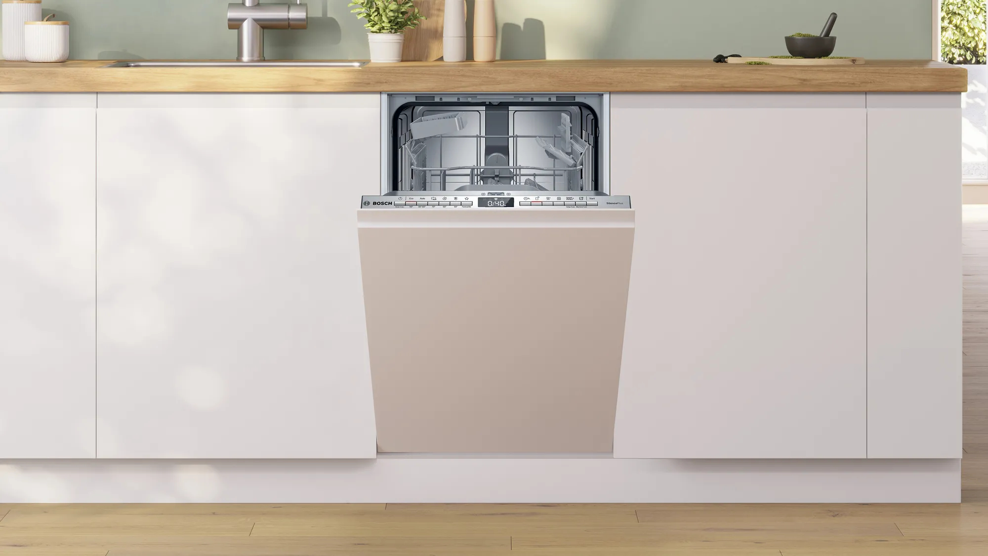 Una lavastoviglie con porta beige neutro, integrata in una cucina.