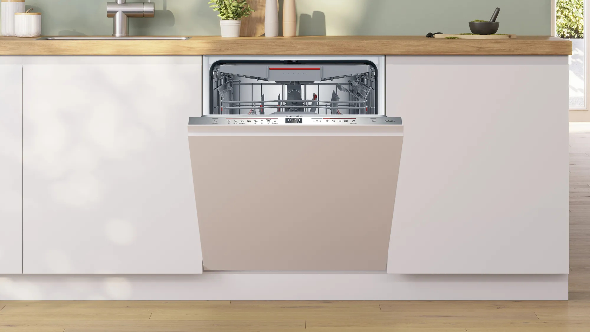 Lavastoviglie beige chiusa integrata in una cucina bianca. Il pannello frontale è beige.