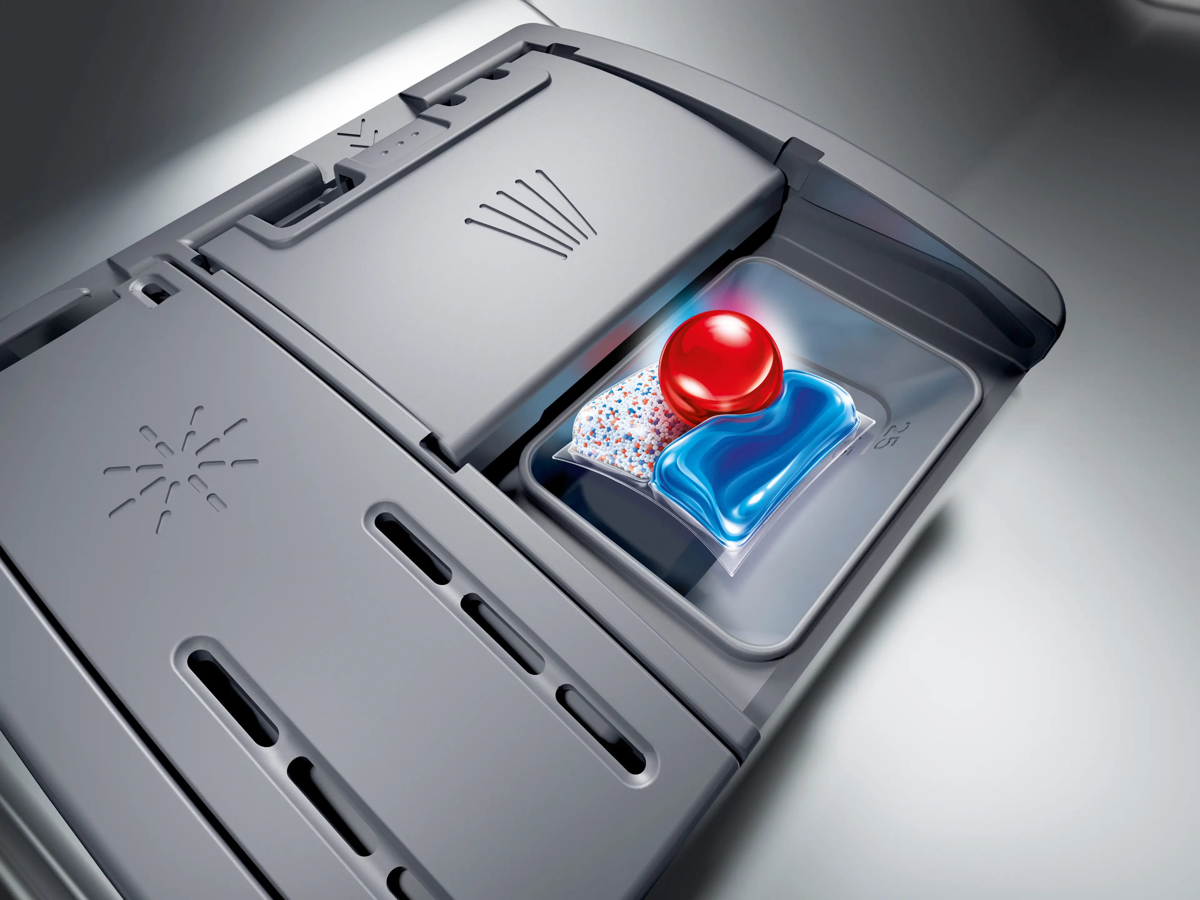 Vaatwasmiddeldispenser met een blauwe en rode vaatwasmiddelpod.