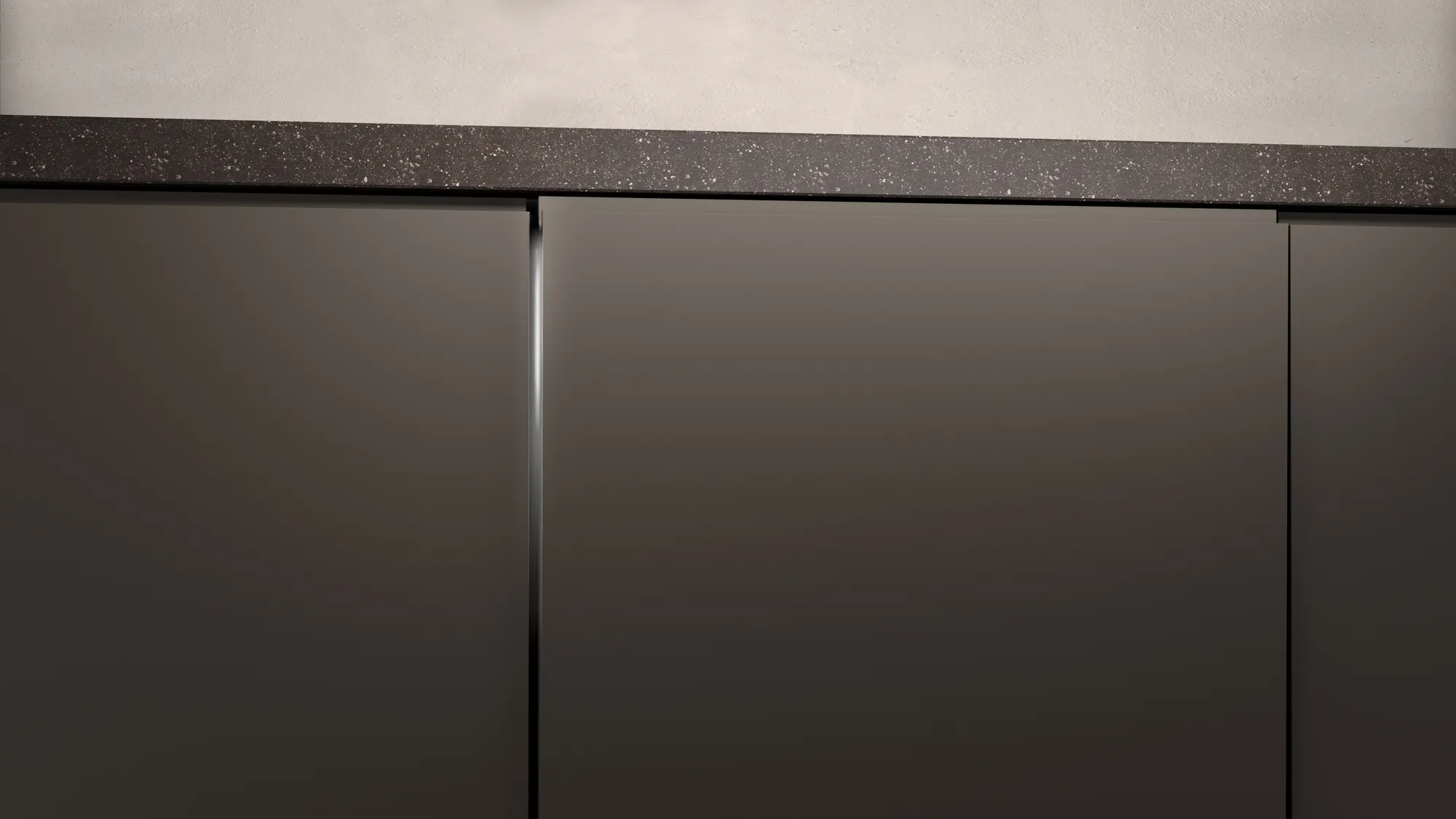Dunkelgraue Küchenschränke mit Granit-Arbeitsplatte, Nahaufnahme.