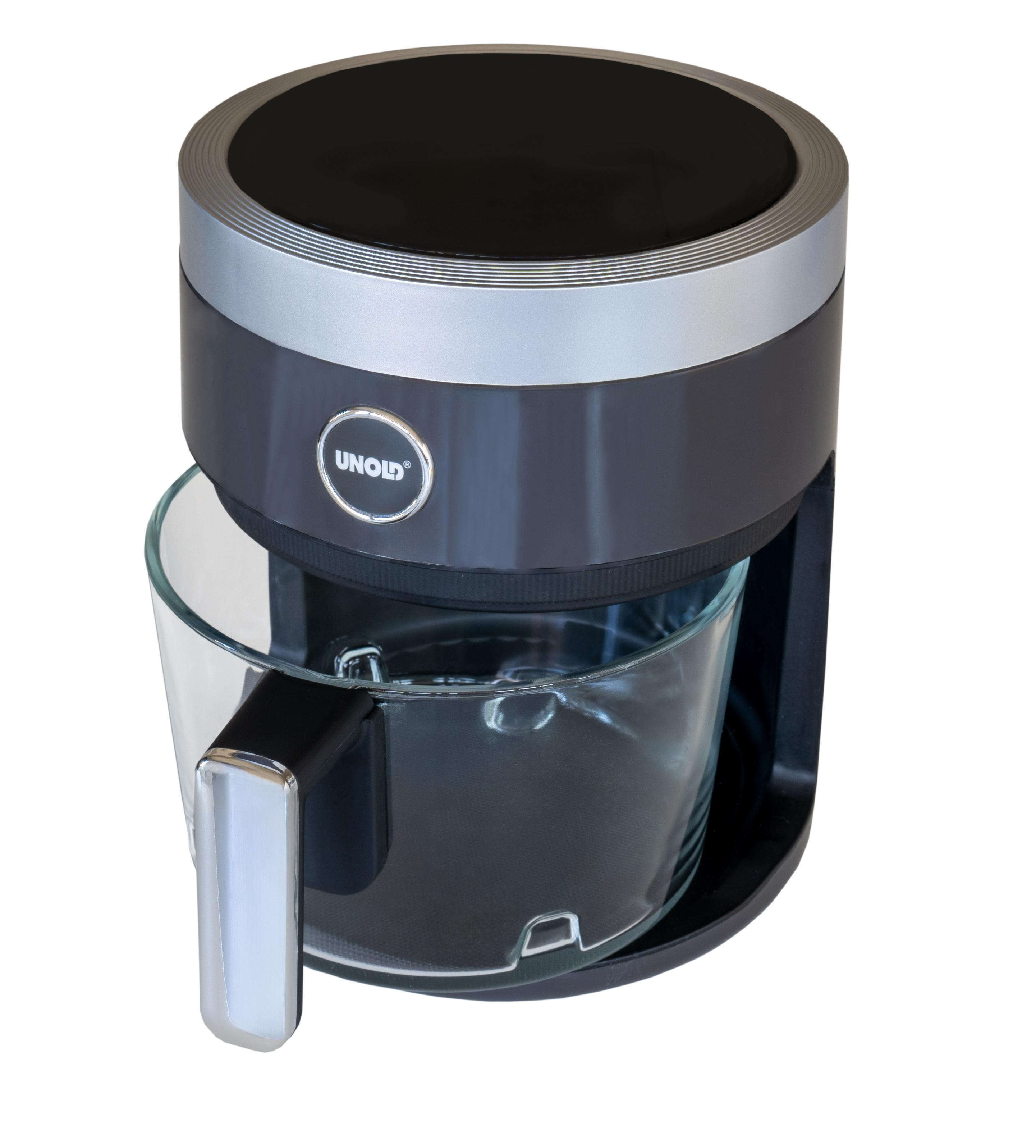 Czarny i srebrny ekspres do kawy ze szklaną karafką. Maszyna stoi na białej powierzchni.