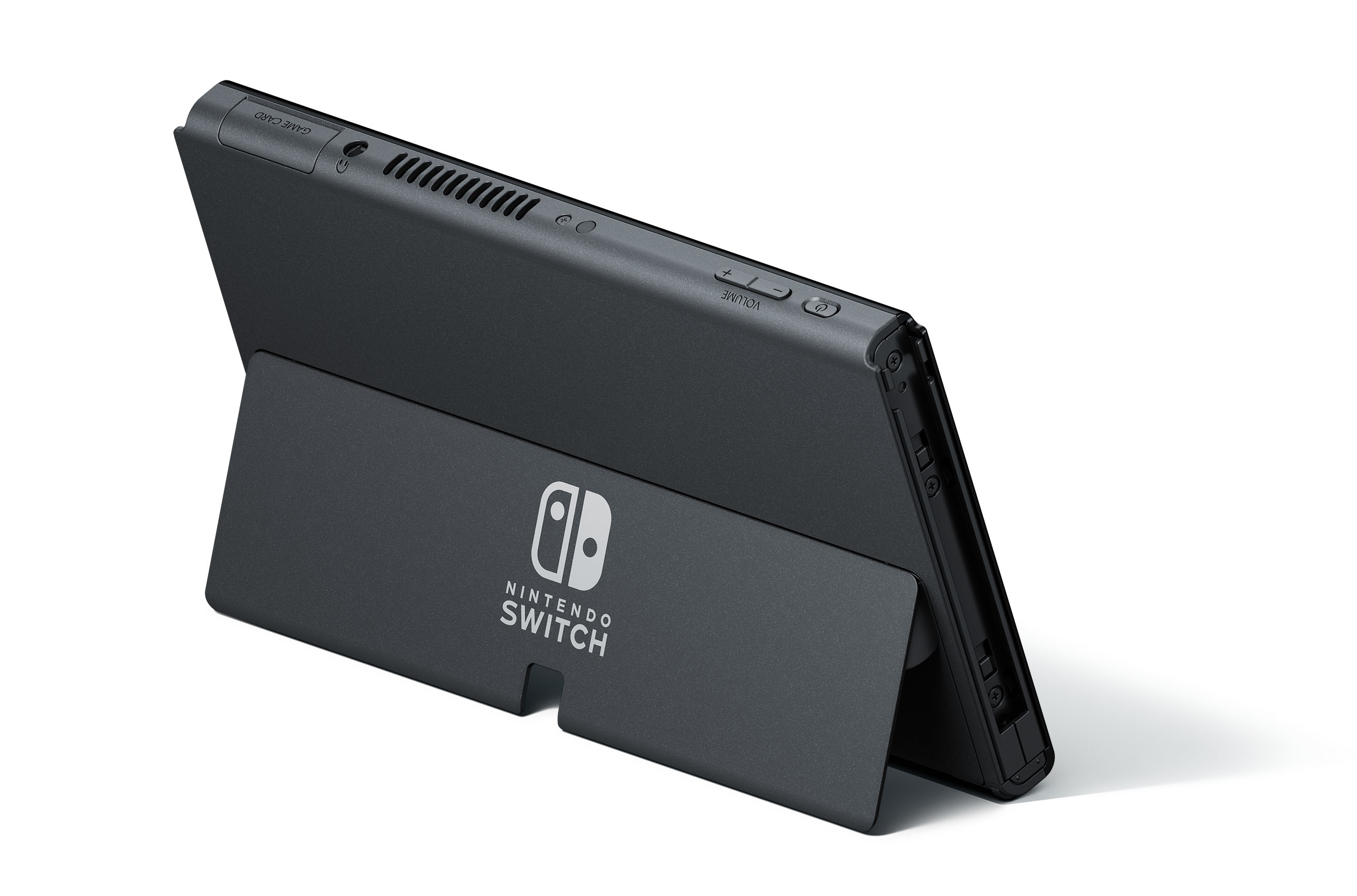 Schwarze Nintendo Switch Konsole, schräge Ansicht. Ständer befestigt. Logo sichtbar. Lautstärke.
