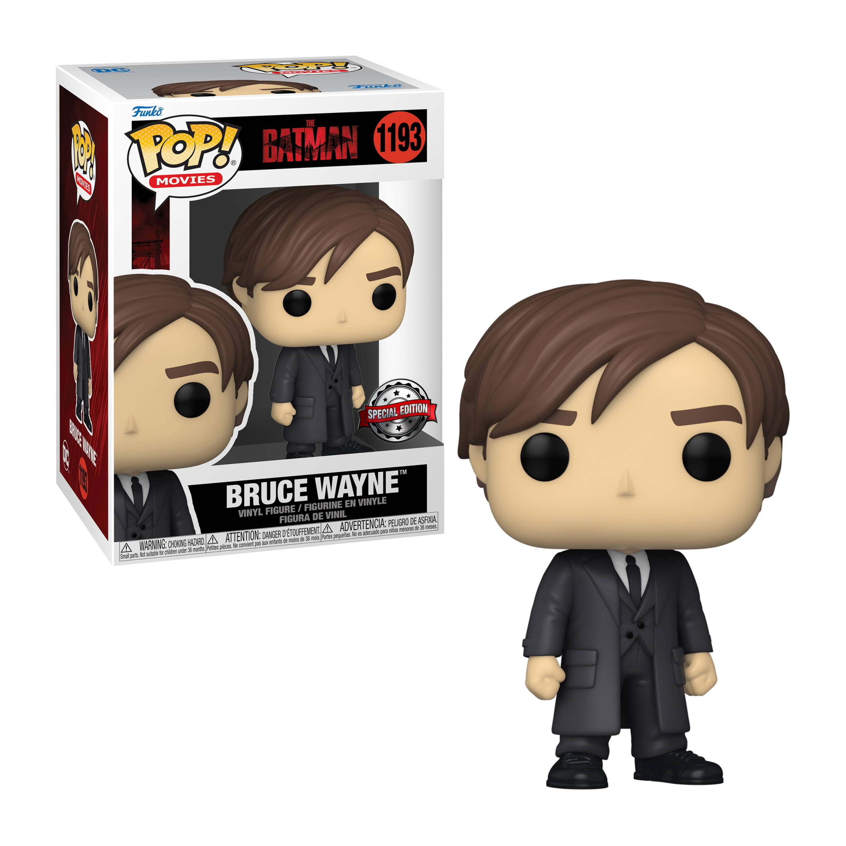 Figura Funko Pop di Bruce Wayne in abito, capelli neri, accanto alla scatola con l'immagine.