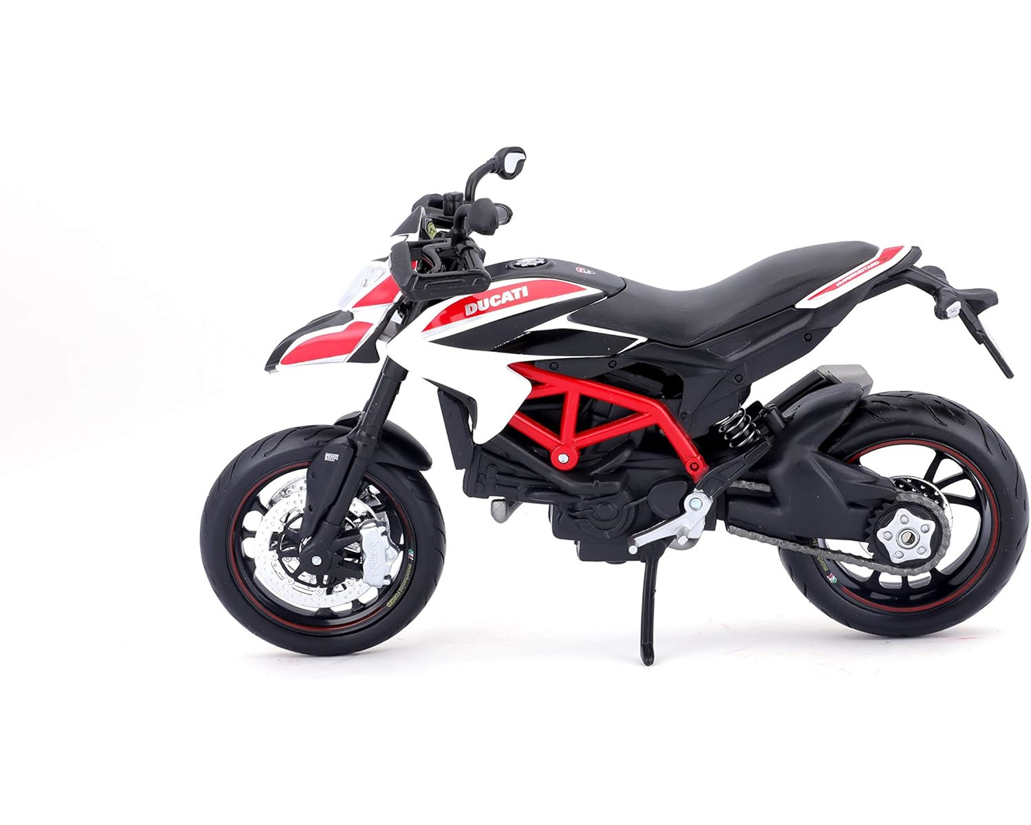 Ein Ducati Motorradmodell, überwiegend schwarz und weiß, auf einer weißen Oberfläche.
