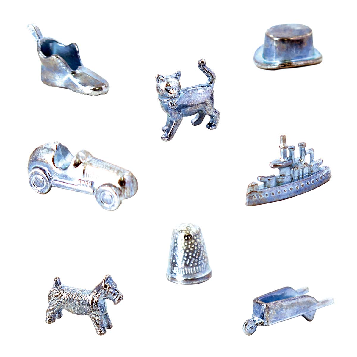 Monopoly-Spielsteine: Schuh, Katze, Auto, Hut, Schiff, Fingerhut, Hund und Schubkarre.