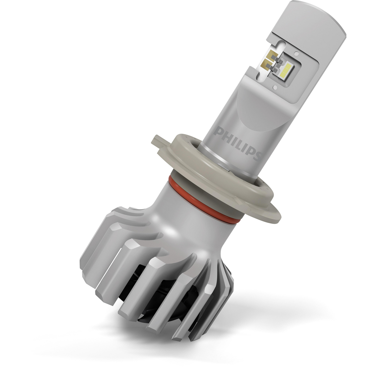 Eine Philips LED-Scheinwerferlampe mit silbernem und rotem Sockel, vor weißem Hintergrund.
