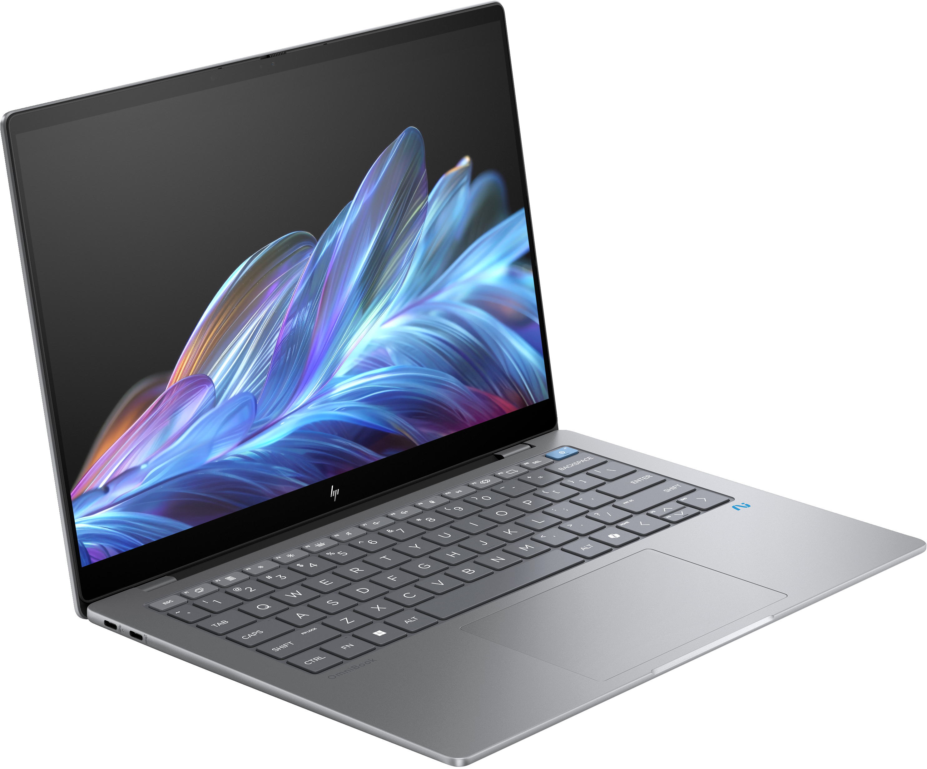 Una laptop plateada está abierta. La pantalla muestra un diseño abstracto y colorido. Teclado y panel táctil visibles.