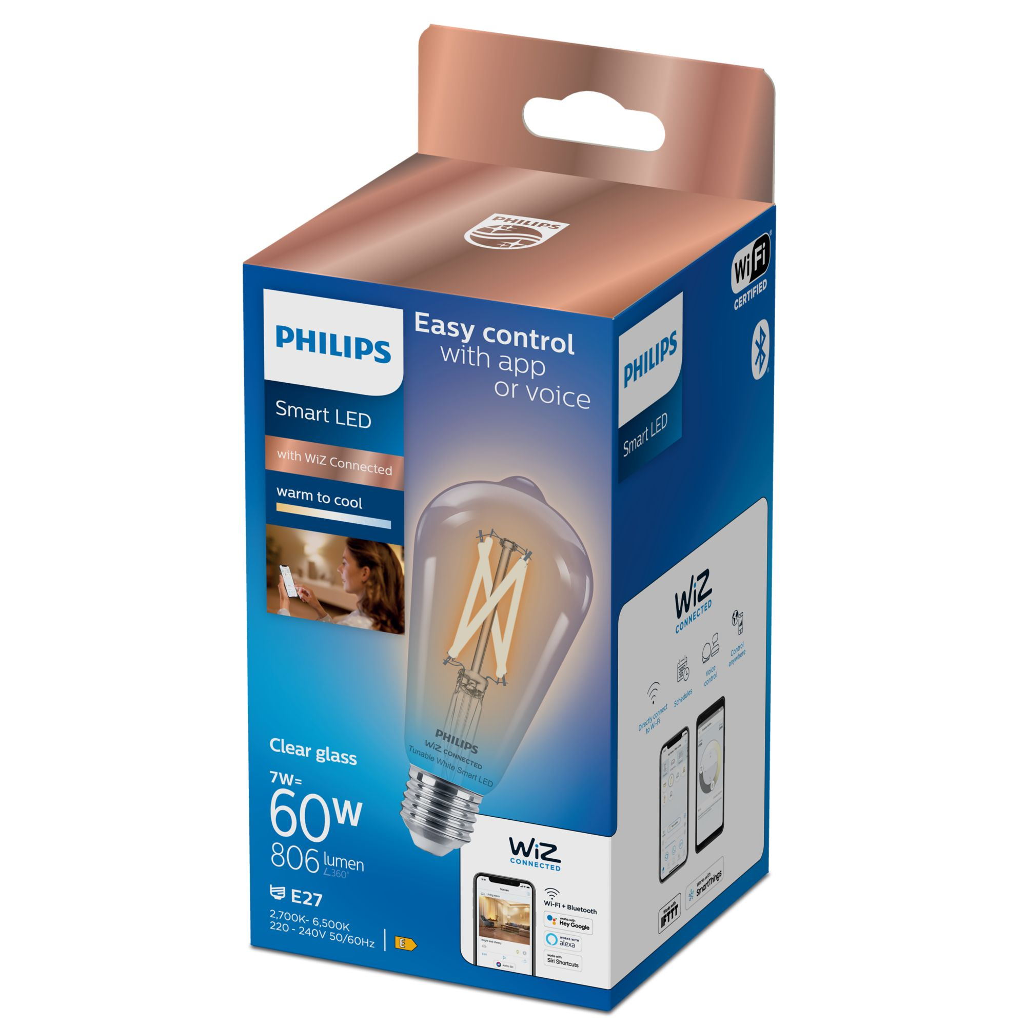 Una caja de bombilla LED Philips. La bombilla es transparente con filamento visible.