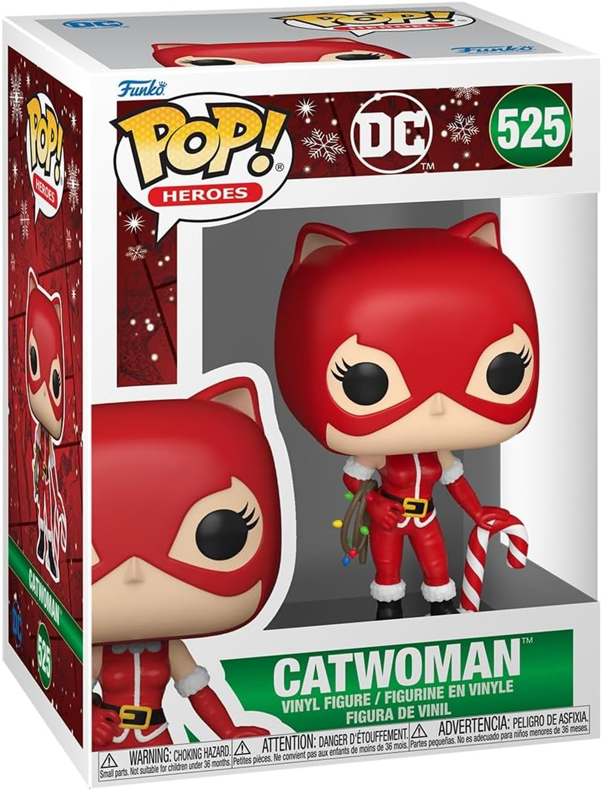 Figura de Catwoman en una caja. Lleva un atuendo rojo con una máscara y un bastón de caramelo.