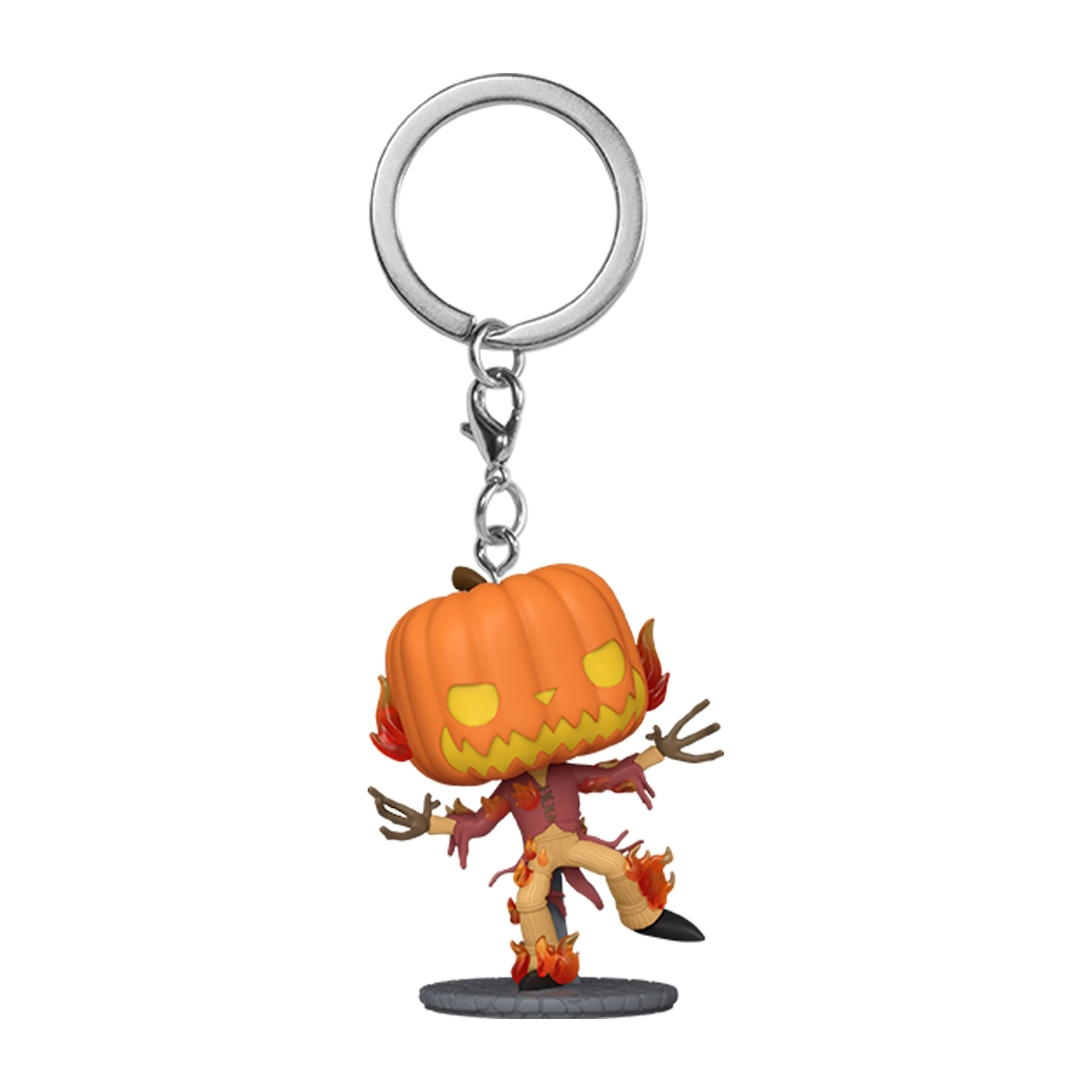 Schlüsselanhänger mit einer kürbisköpfigen Figur. Orange, gelb und braun.