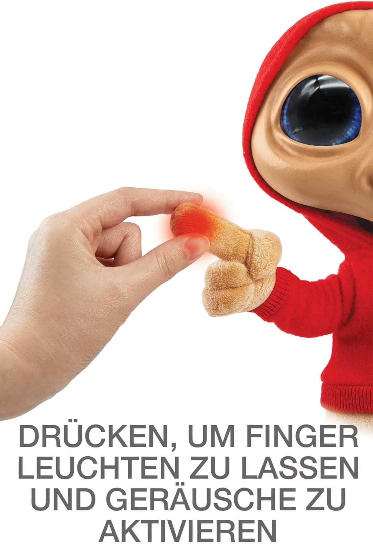 Hand berührt E.T.s leuchtenden Finger. Text: Drücken, um Finger leuchten zu lassen und Geräusche zu aktivieren.