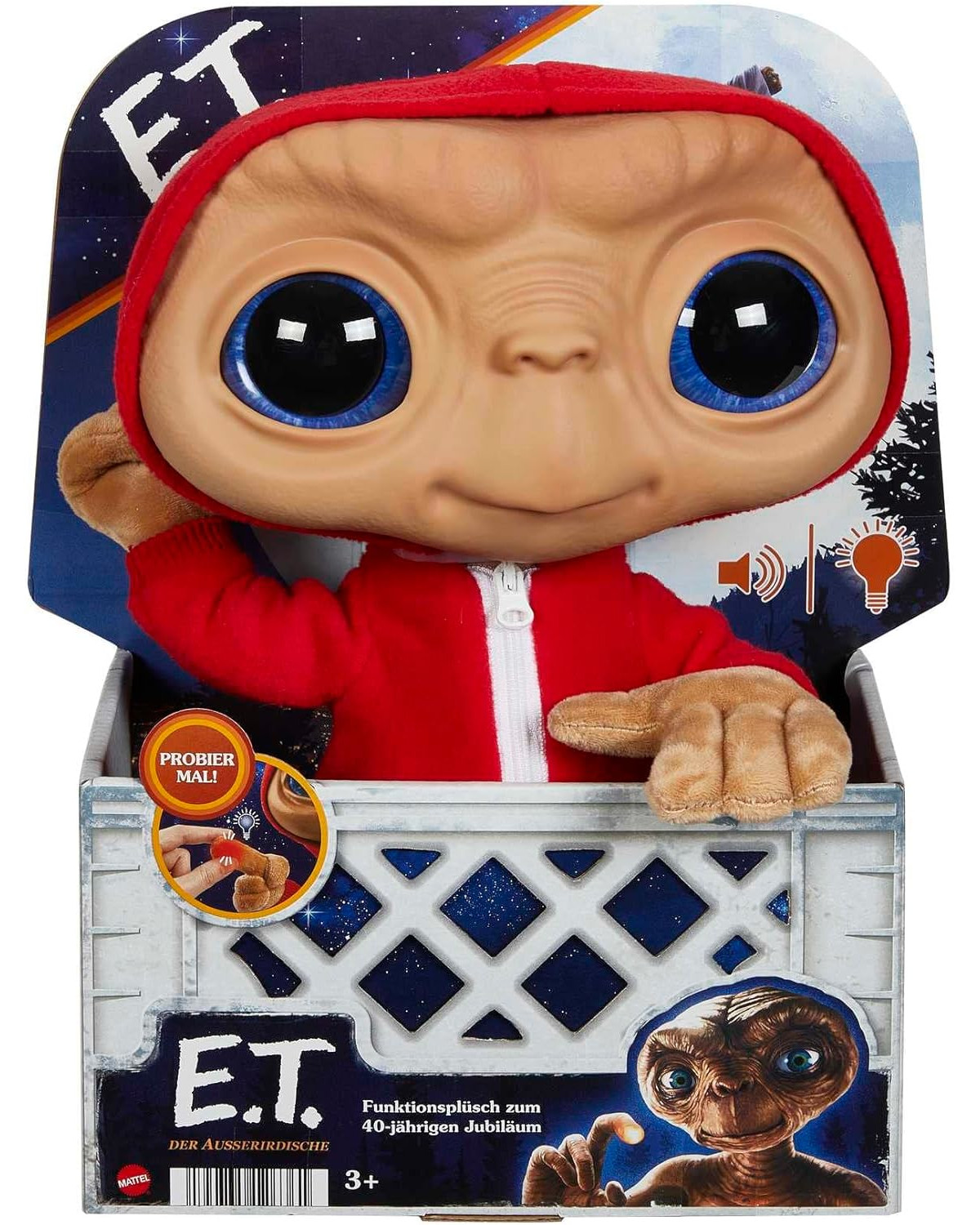 E.T. Plüschtier im roten Kapuzenpullover in einer Box. Große blaue Augen und braune Haut.