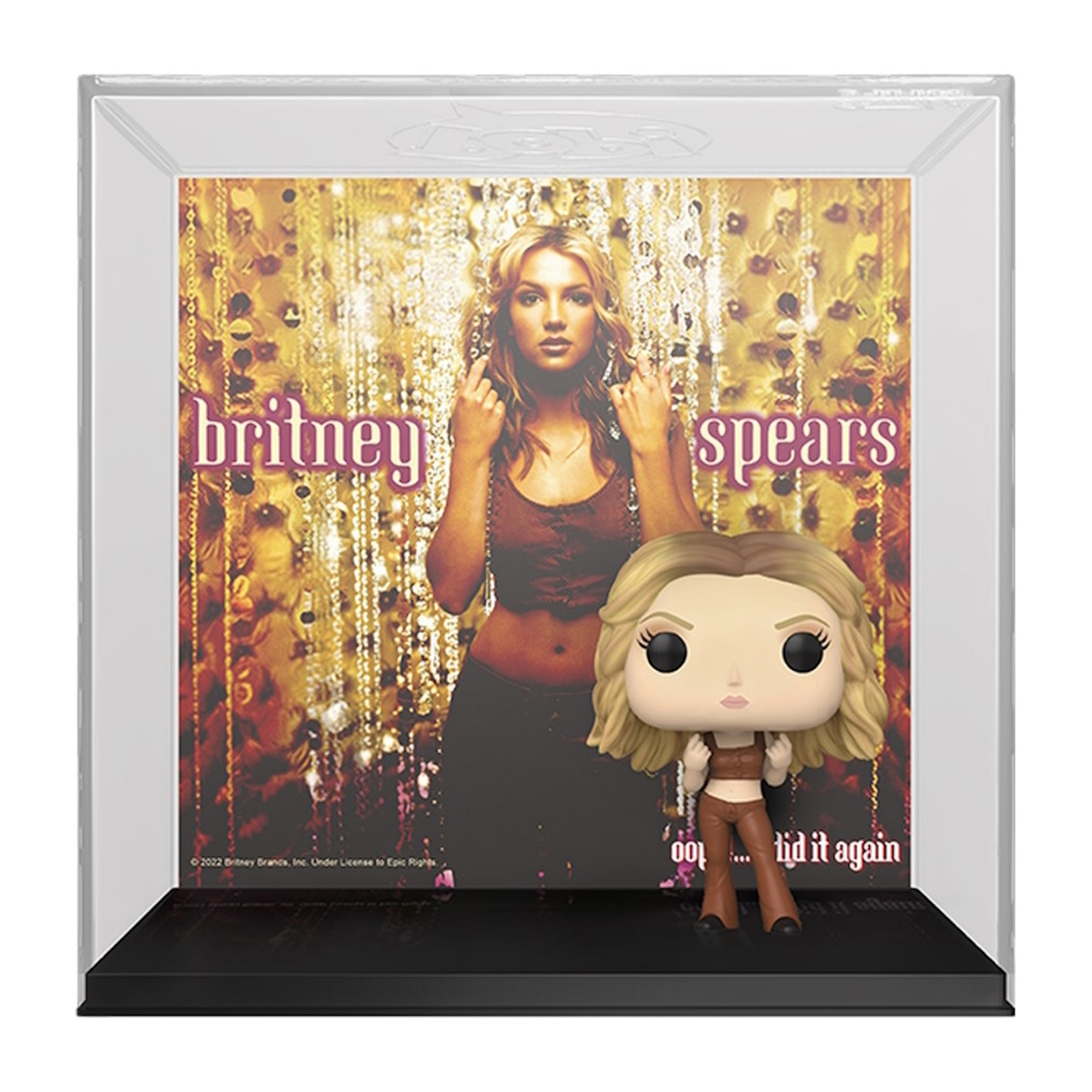 Britney Spears Funko Pop Figur in einer Vitrine, vor ihrem Albumcover stehend.
