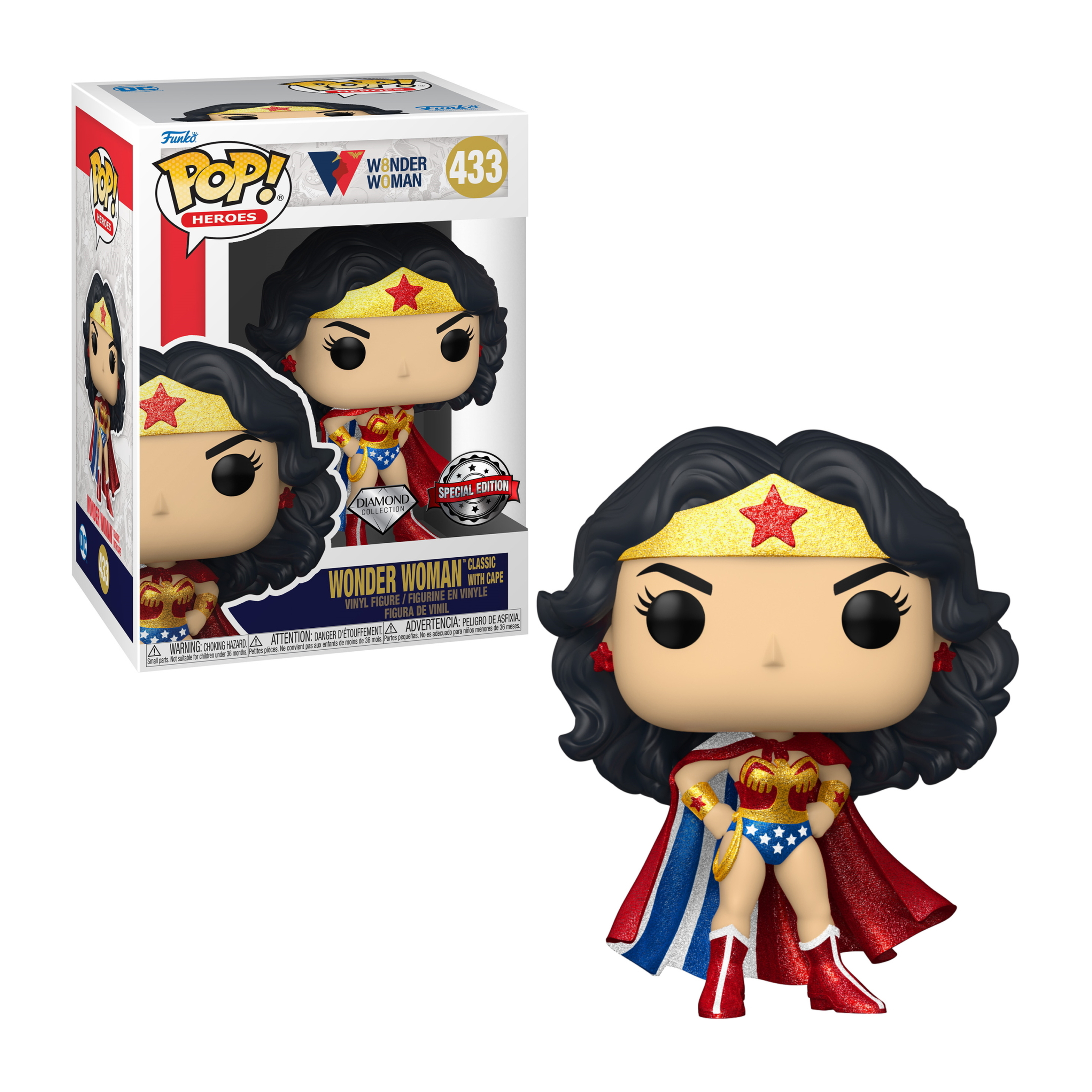 Wonder Woman Figur im klassischen Kostüm mit Umhang. Schwarzes Haar, goldene Tiara. Box mit Bild im Hintergrund.
