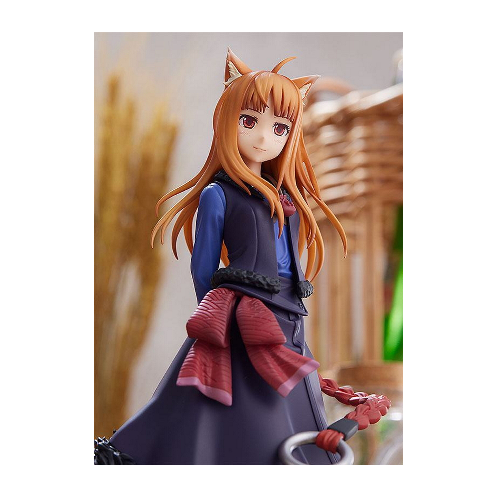 Anime-Figur, Mädchen mit orangenen Haaren und Ohren, blaues Hemd, rote Schleife und dunkler Rock. Hintergrund mit Korb.