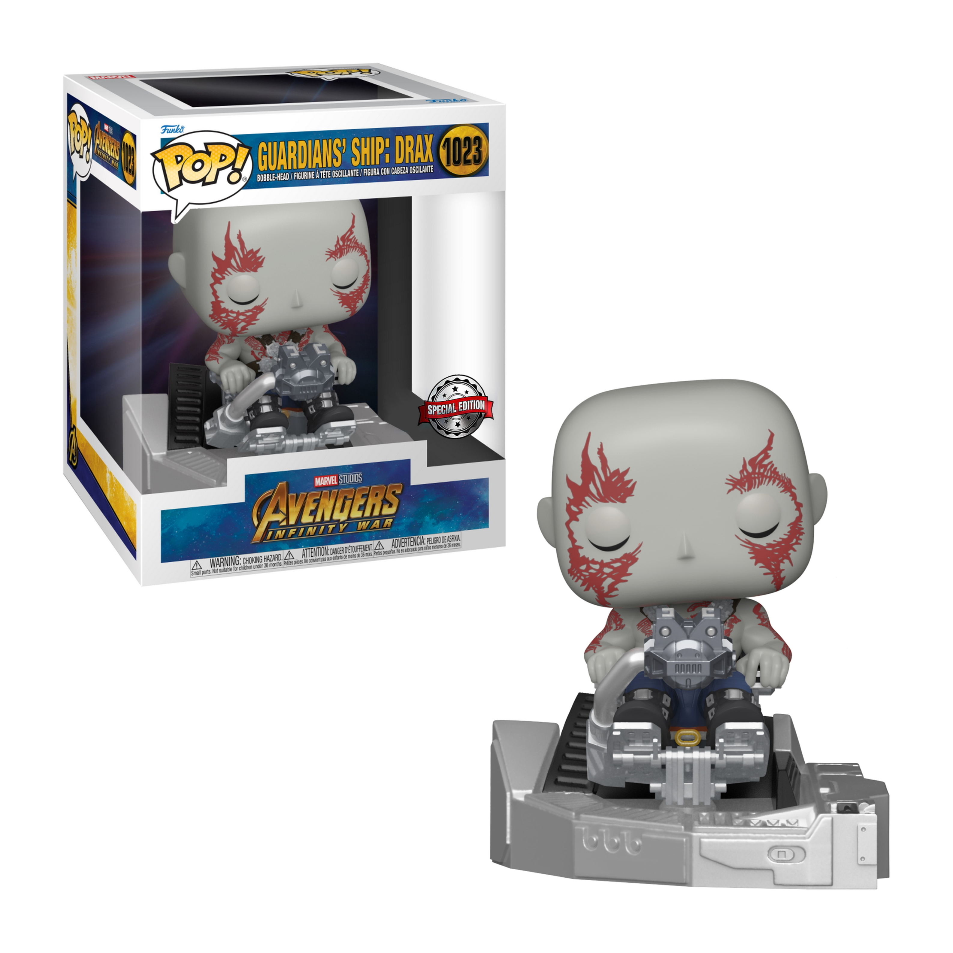 Drax Funko Pop Figur in einem Fahrzeug. Die Box ist ebenfalls sichtbar.
