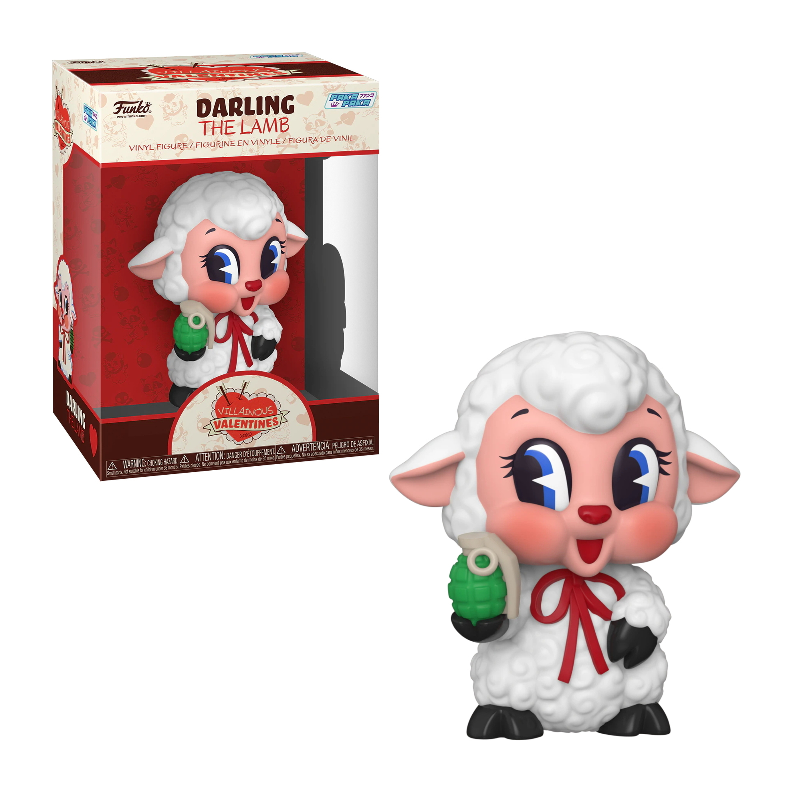 Biały baranek z czerwoną kokardą trzymający zielony granat. Ma różowe policzki i niebieskie oczy. Pudełko z tyłu.