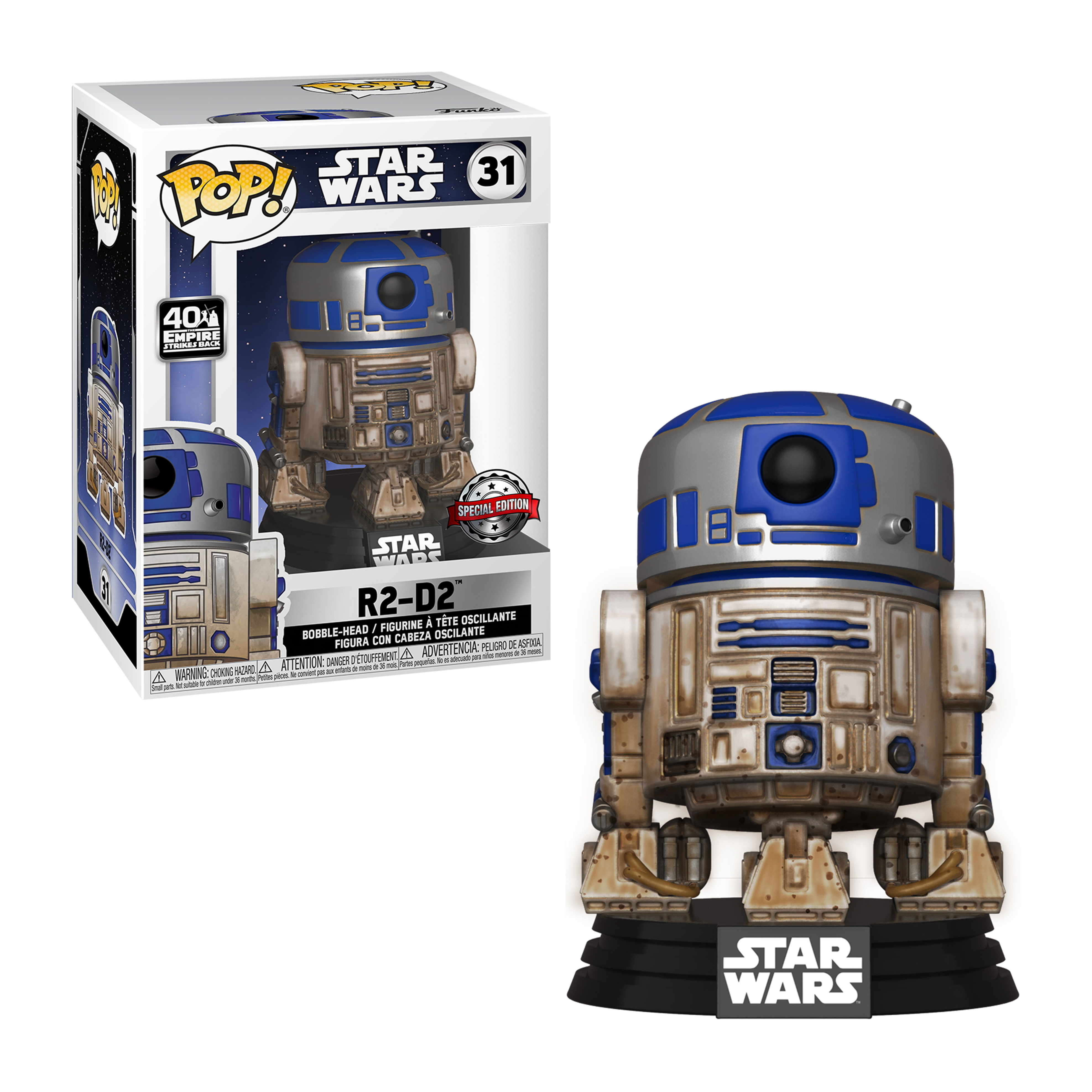 R2-D2 Figur. Blaue, silberne und braune Farben. Es steht vor einer Box mit derselben Figur darauf.