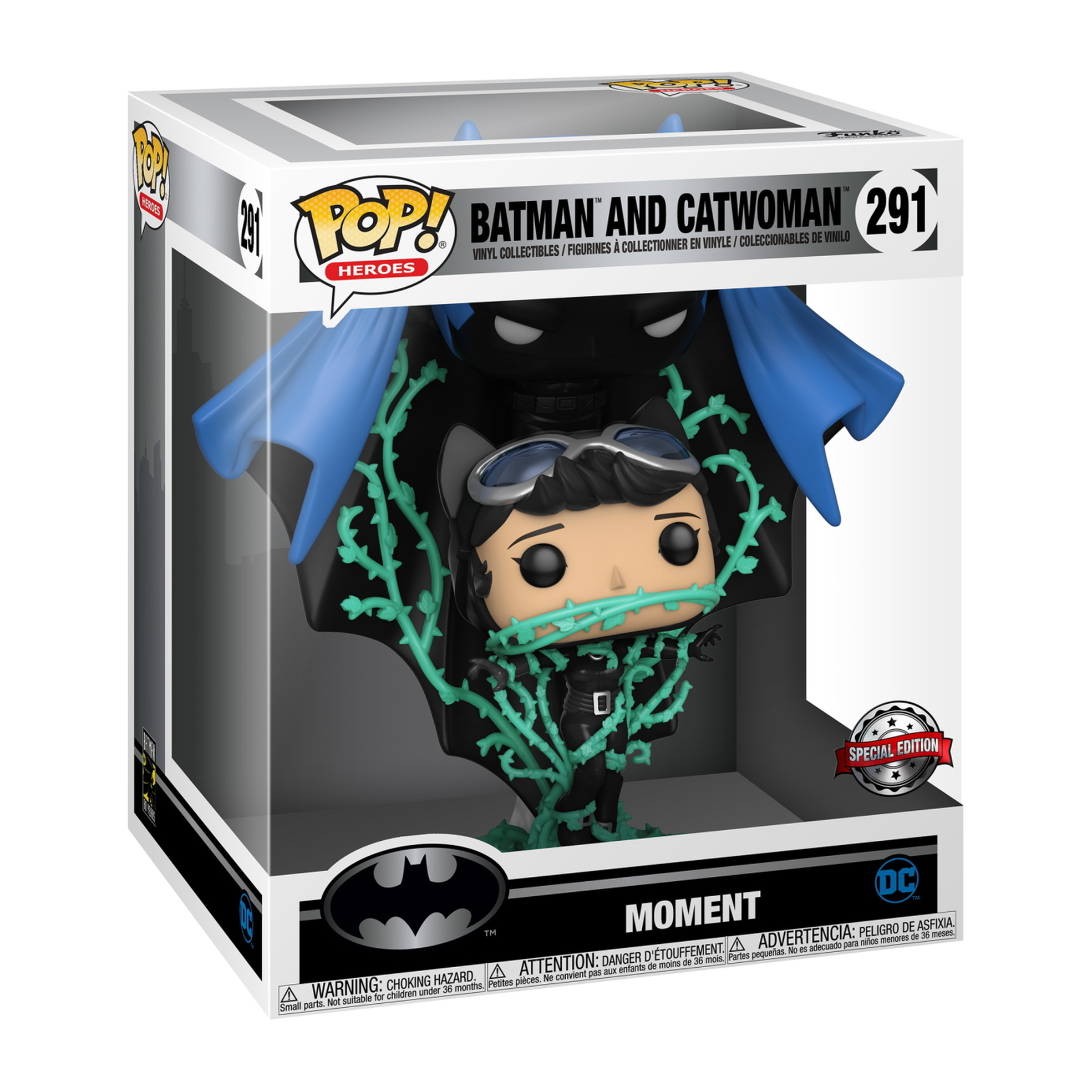 Batman- und Catwoman-Figur in einer Box. Schwarze Figuren, blauer Umhang, mit grünen Ranken und einem Sonderaufkleber.