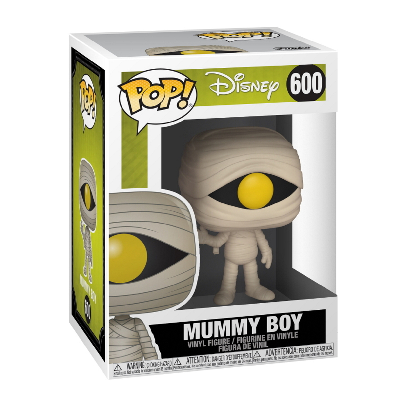 Figura di Mummy Boy in una scatola. Beige, avvolto in bende, con un occhio giallo e un oggetto giallo.
