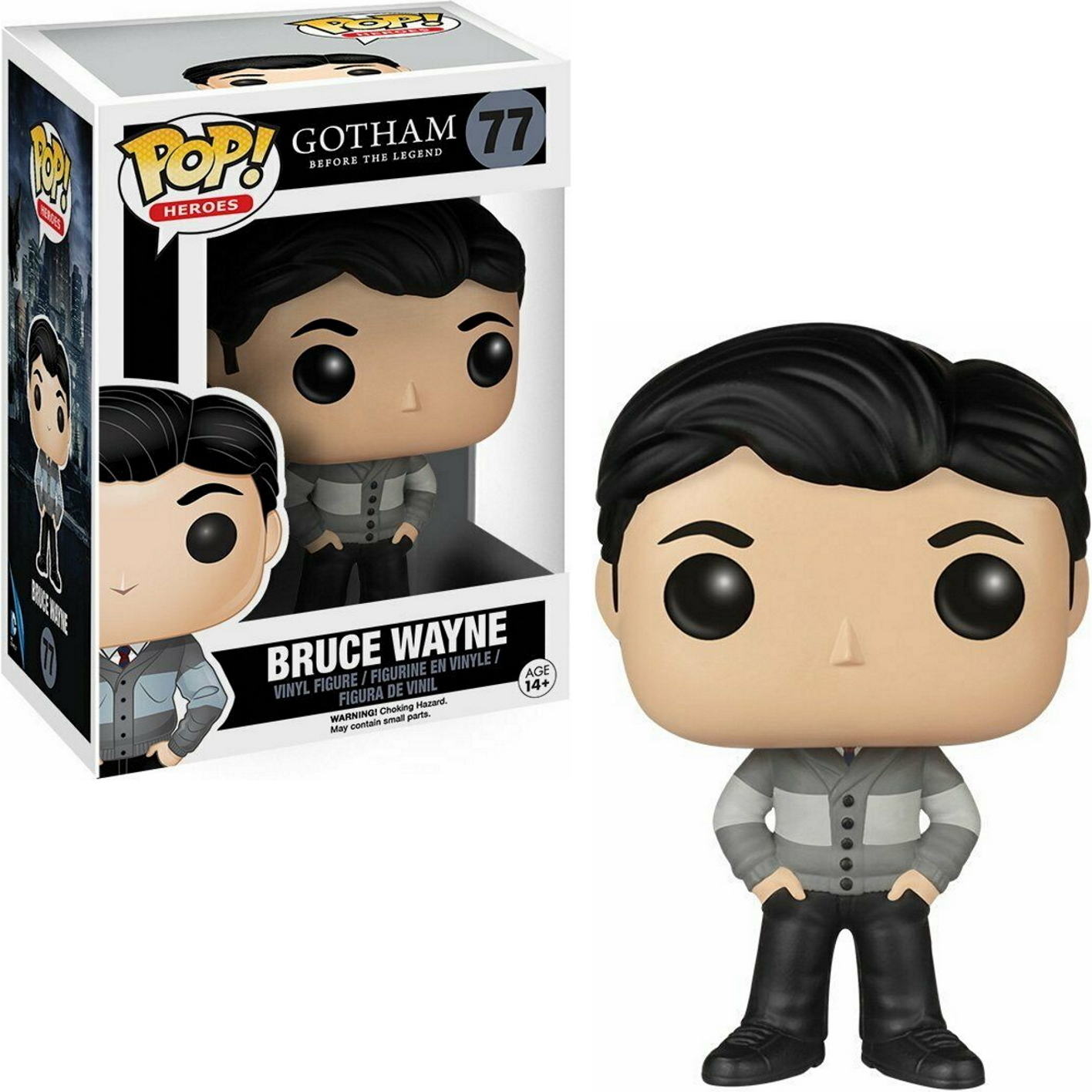 Bruce Wayne Funko Pop Figur und Box. Grauer Pullover, schwarzes Haar, schwarze Hose. Weißer Hintergrund.