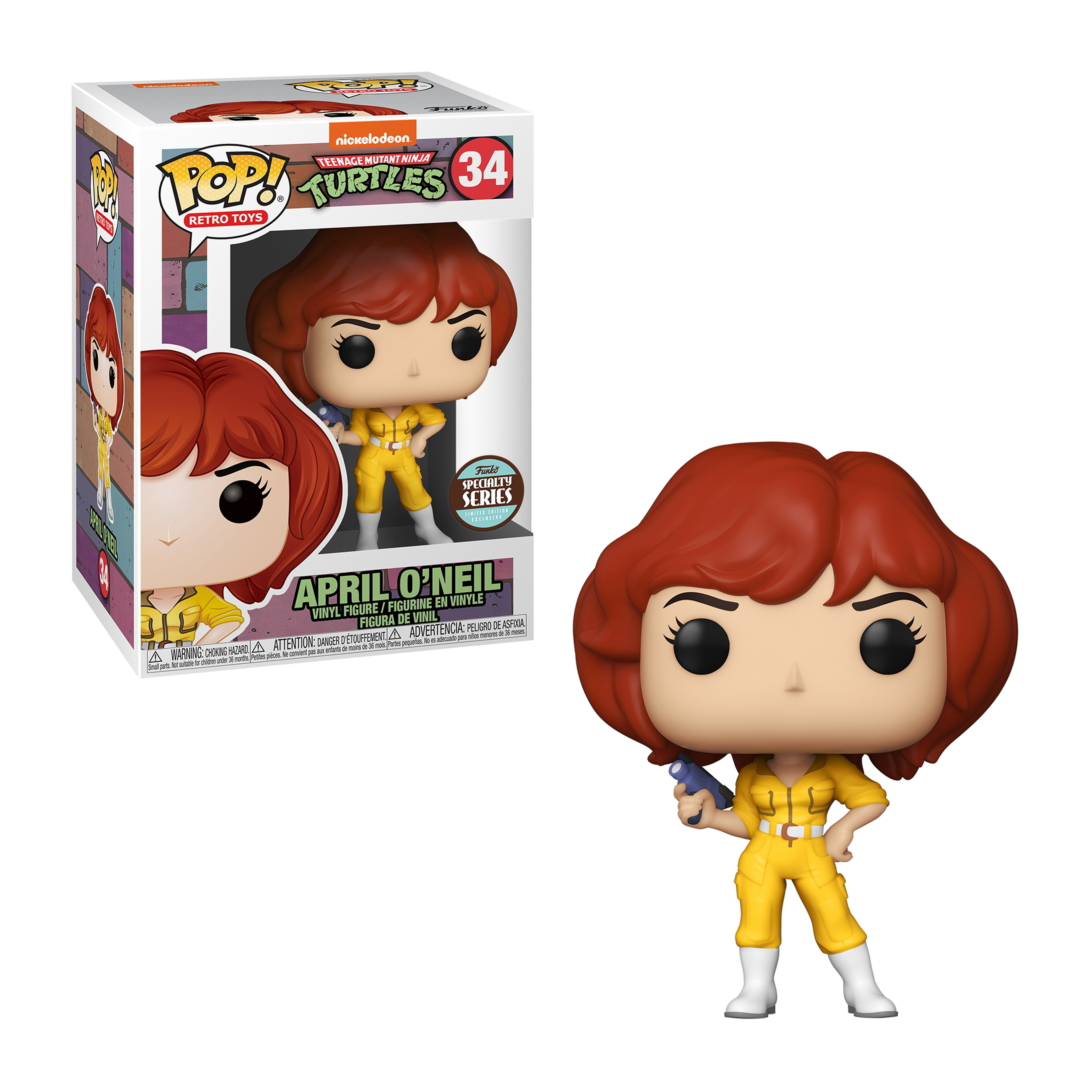 April O'Neil Figur im gelben Overall, hält eine Waffe, mit der Box daneben.
