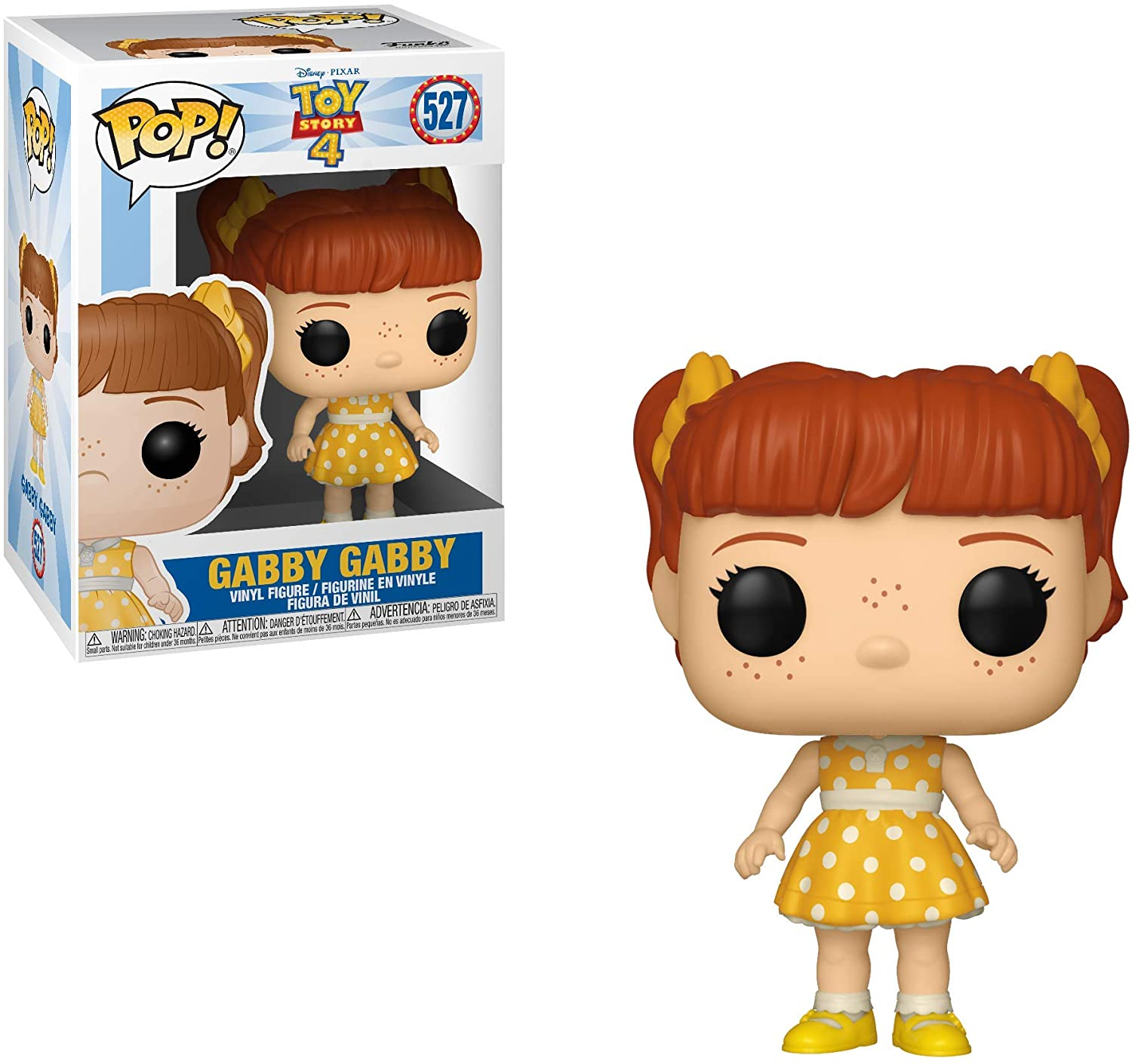 Figura di Gabby Gabby dentro e fuori la scatola. Gabby indossa un vestito giallo a pois bianchi, con lentiggini.
