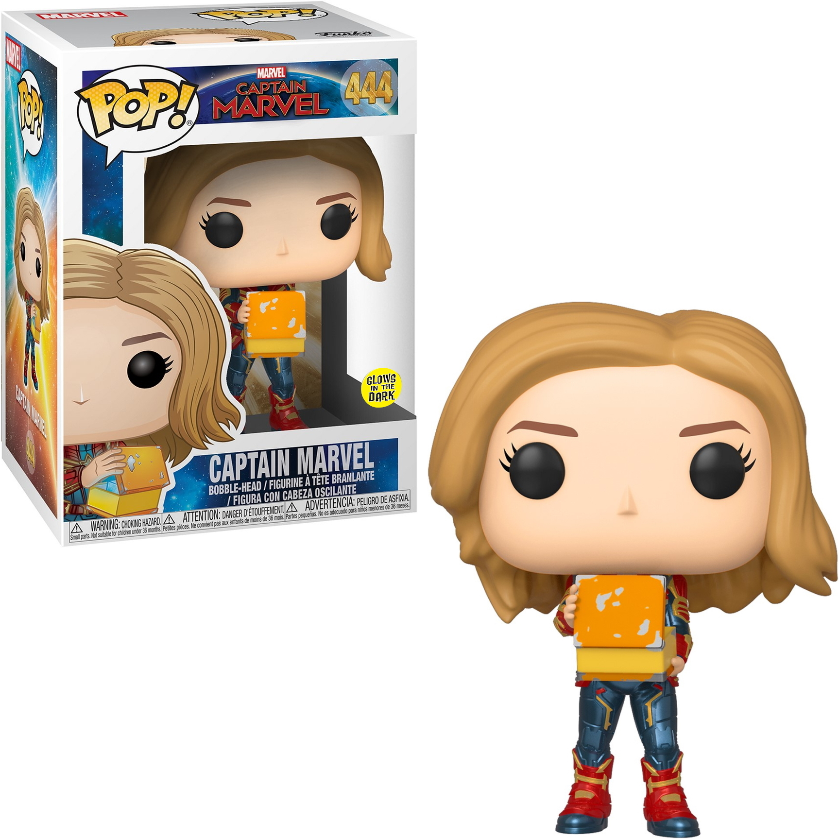 Figura Funko Pop di Captain Marvel che tiene un blocco, con scatola sullo sfondo.