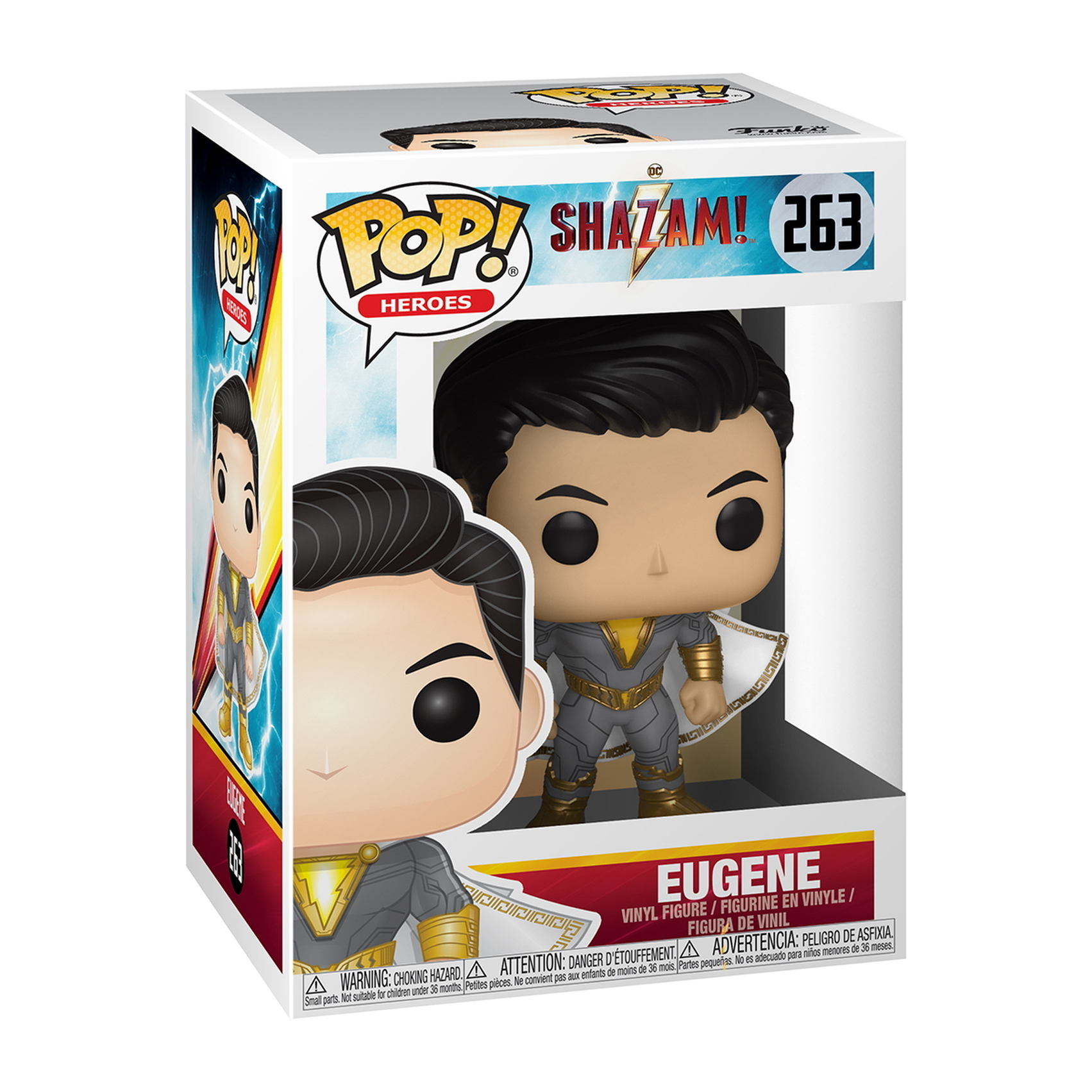 Figurka Eugene w pudełku. Szary i złoty strój Shazama, czarne włosy i poważna twarz.