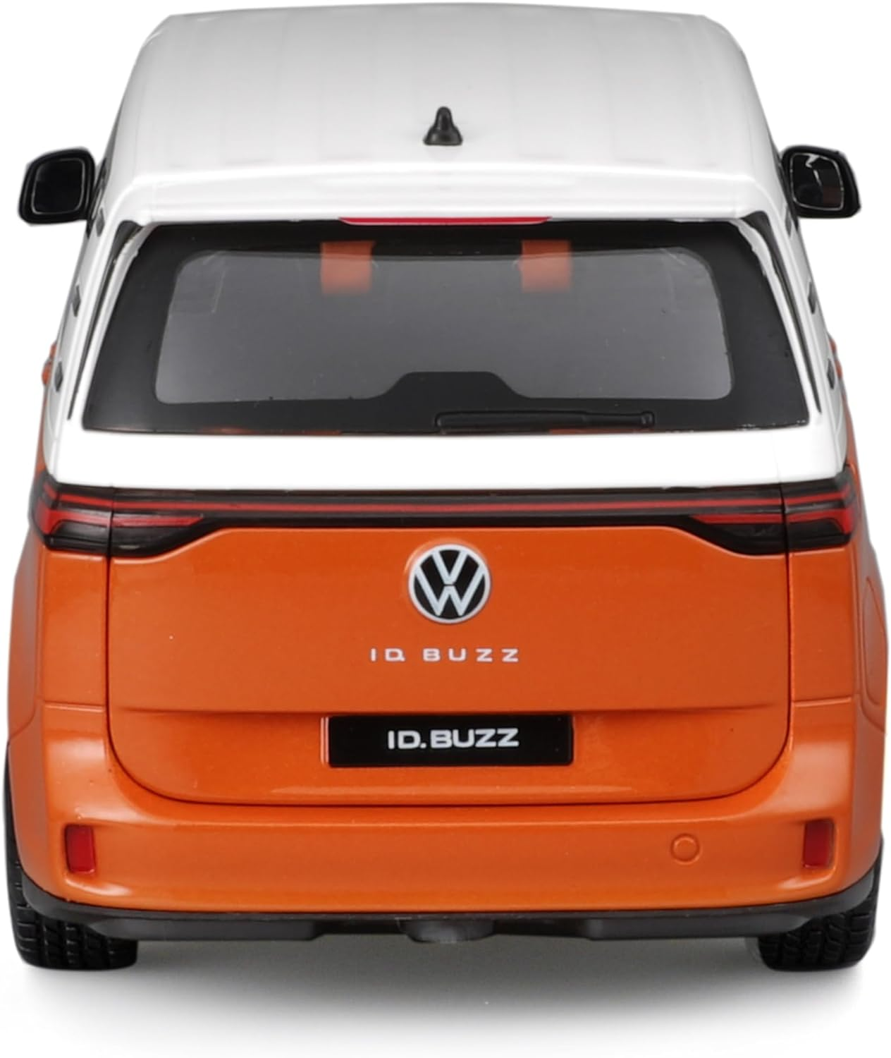 Orangenes und weißes VW ID.Buzz Spielzeugauto, Draufsicht, zeigt Vorder- und Rückseite.