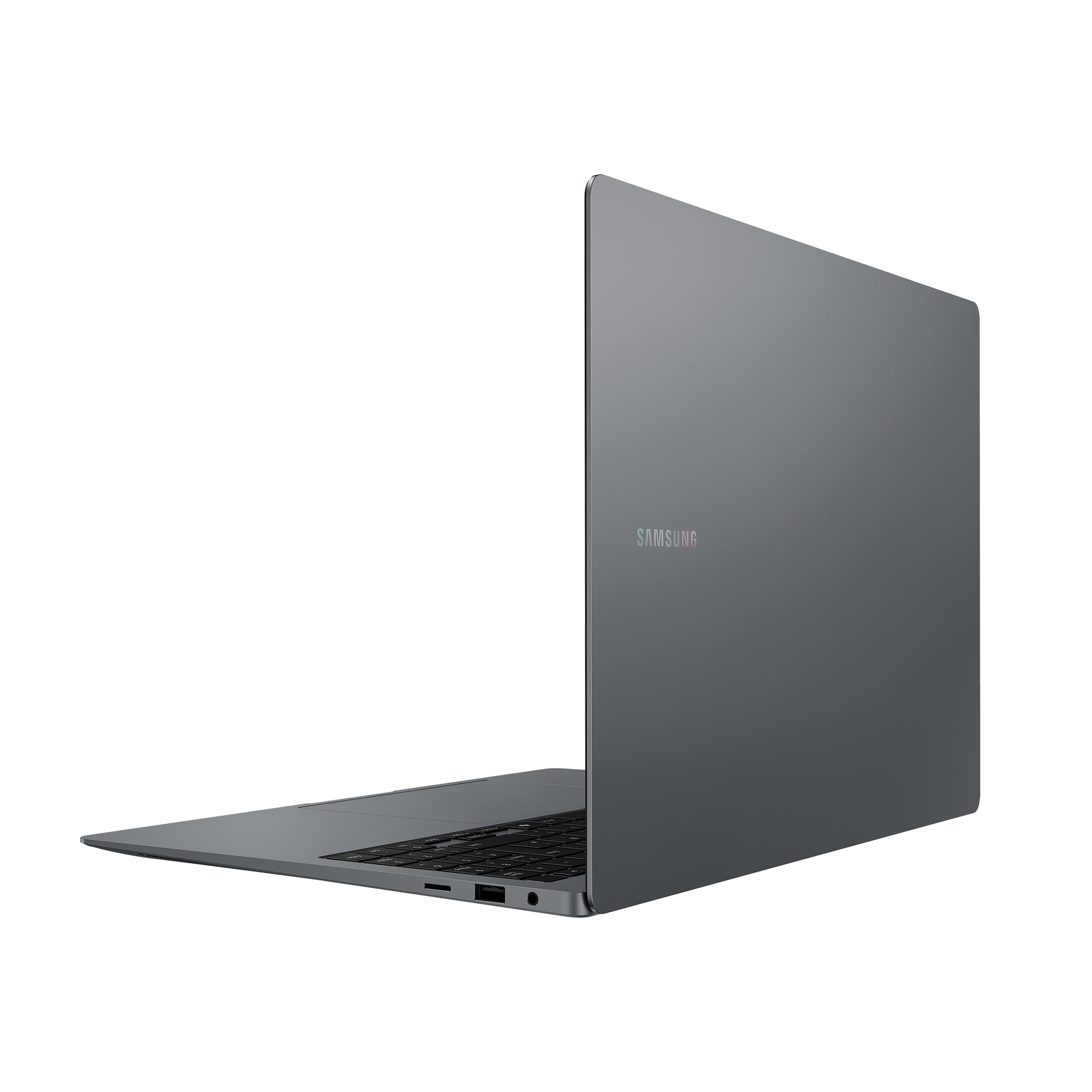 Una laptop Samsung gris, cerrada y en ángulo, mostrando el logotipo de Samsung en la parte trasera.