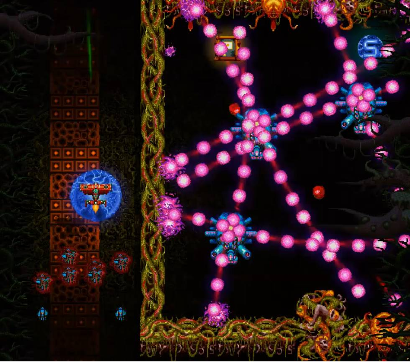 Una vista dall'alto di un gioco arcade retrò. Il livello presenta molti nemici.