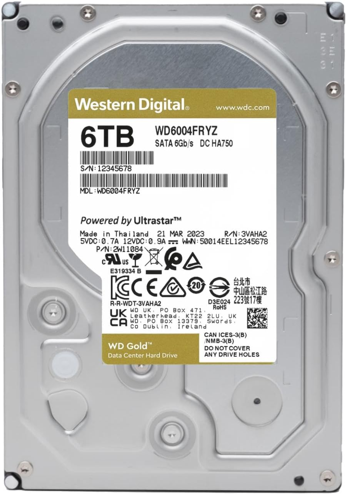 Dysk twardy Western Digital 6TB z etykietami i numerami seryjnymi. Dysk jest srebrny i złoty.