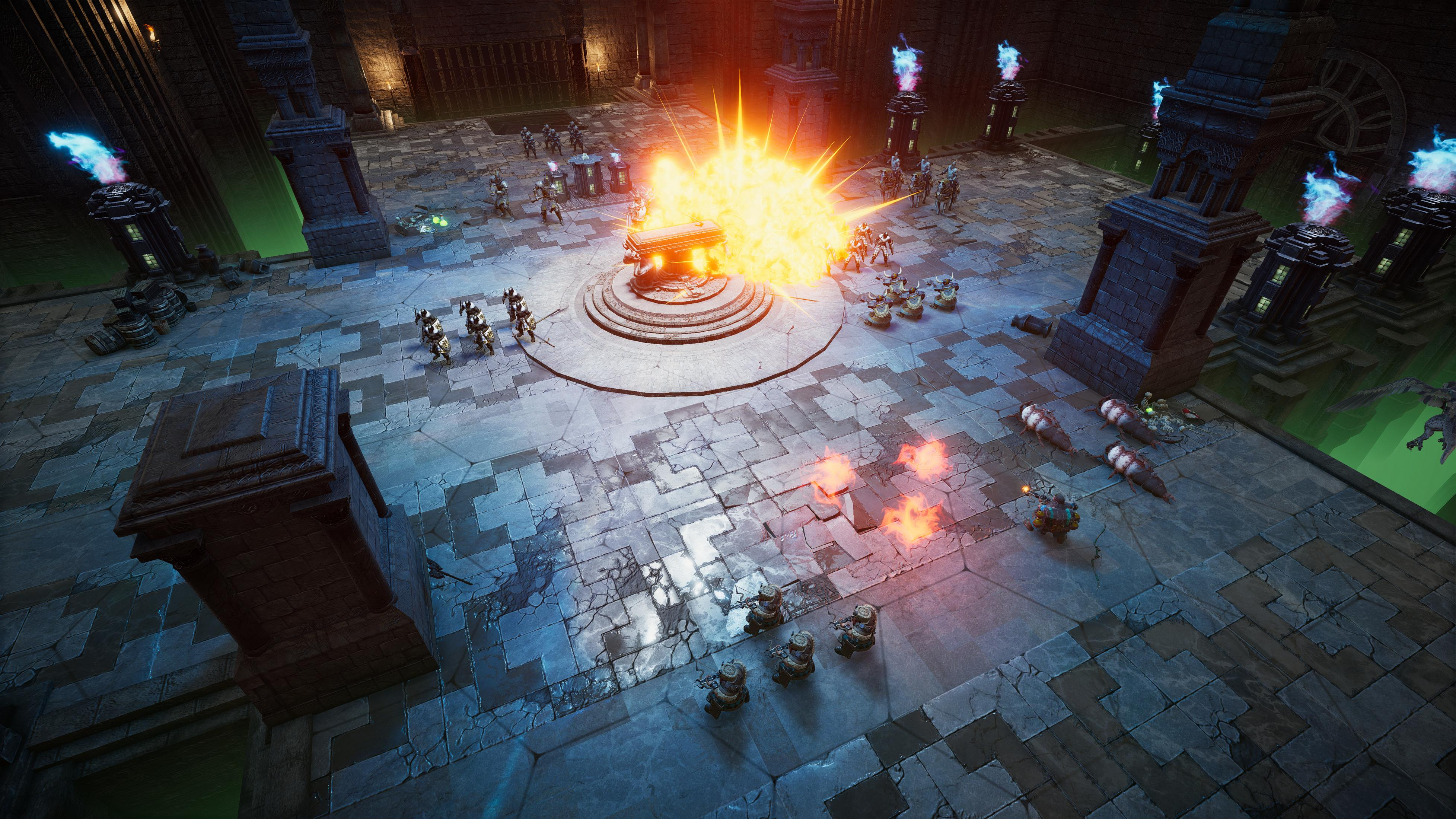 Draufsicht auf eine Spielszene mit großer Explosion und vielen Figuren.