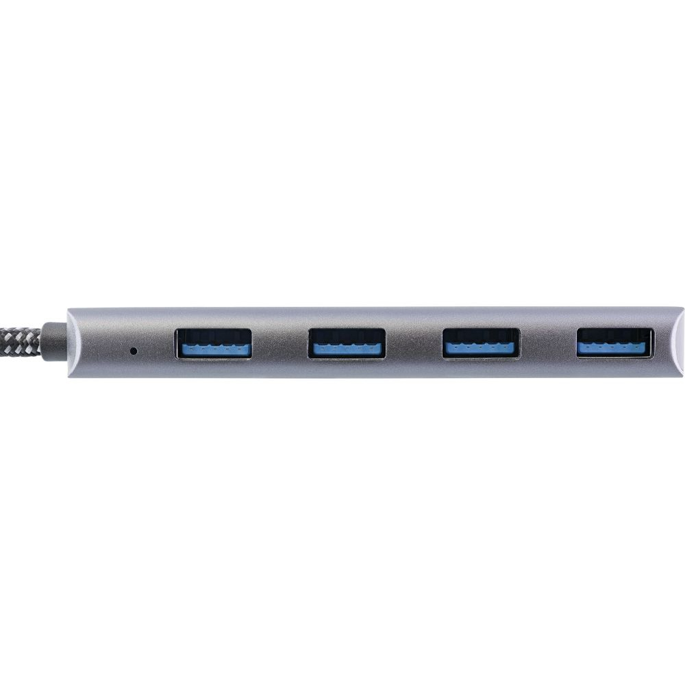 Un primo piano di un hub USB grigio con 4 porte blu. Le porte sono allineate orizzontalmente.