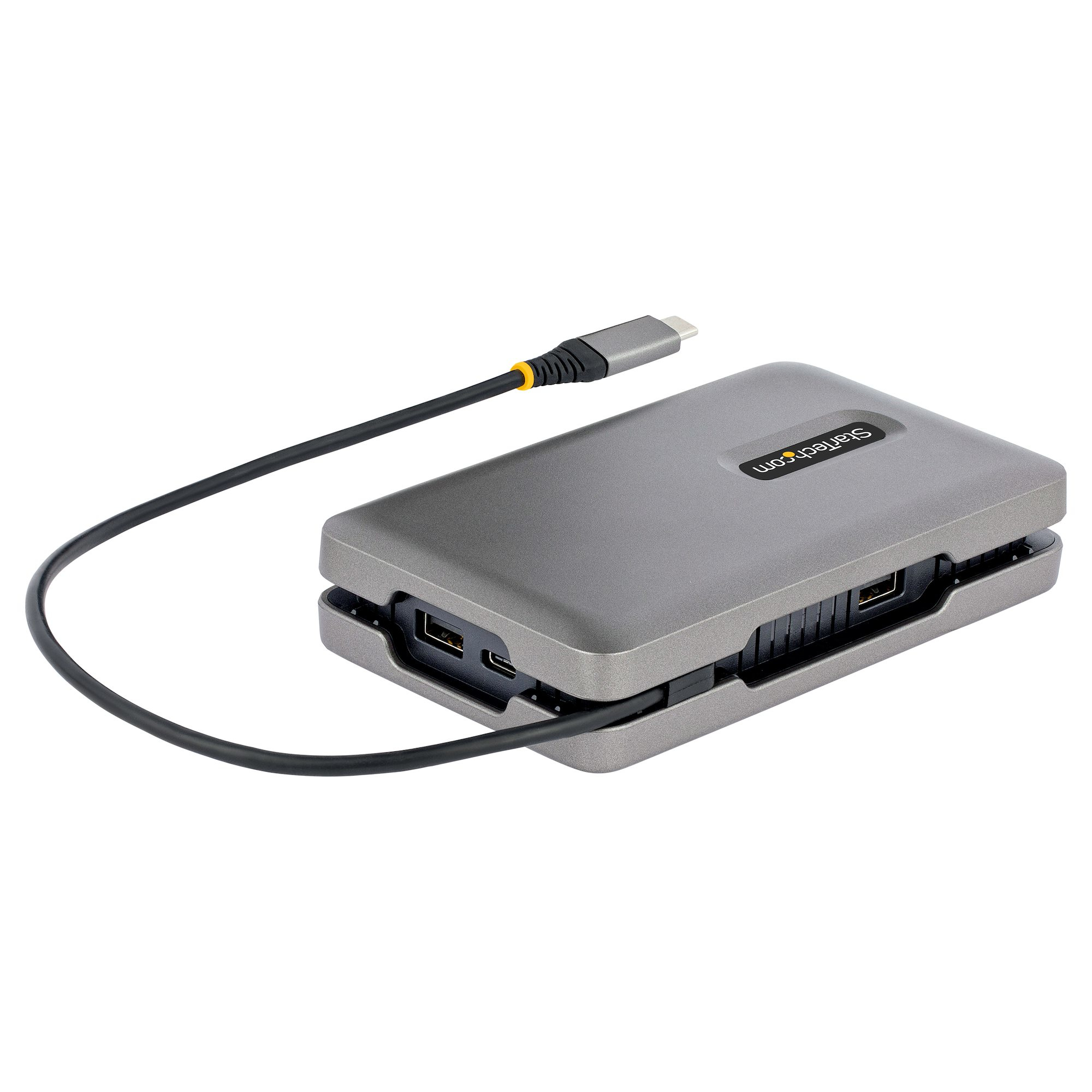 Stazione di docking USB-C StarTech grigia, collegata a un cavo nero. Sfondo bianco.