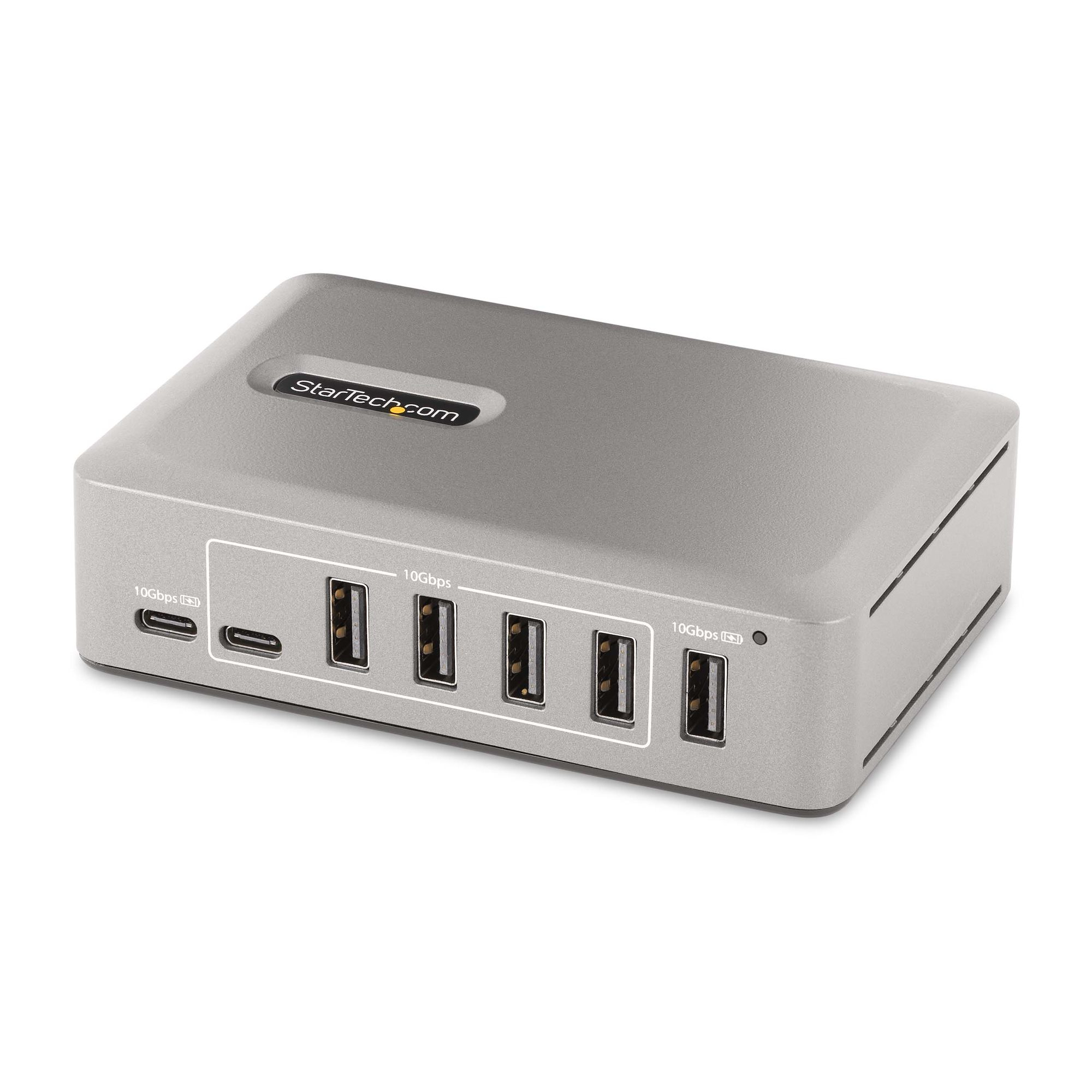 USB-C-Hub. Silbernes, rechteckiges Gerät mit mehreren USB-Anschlüssen.