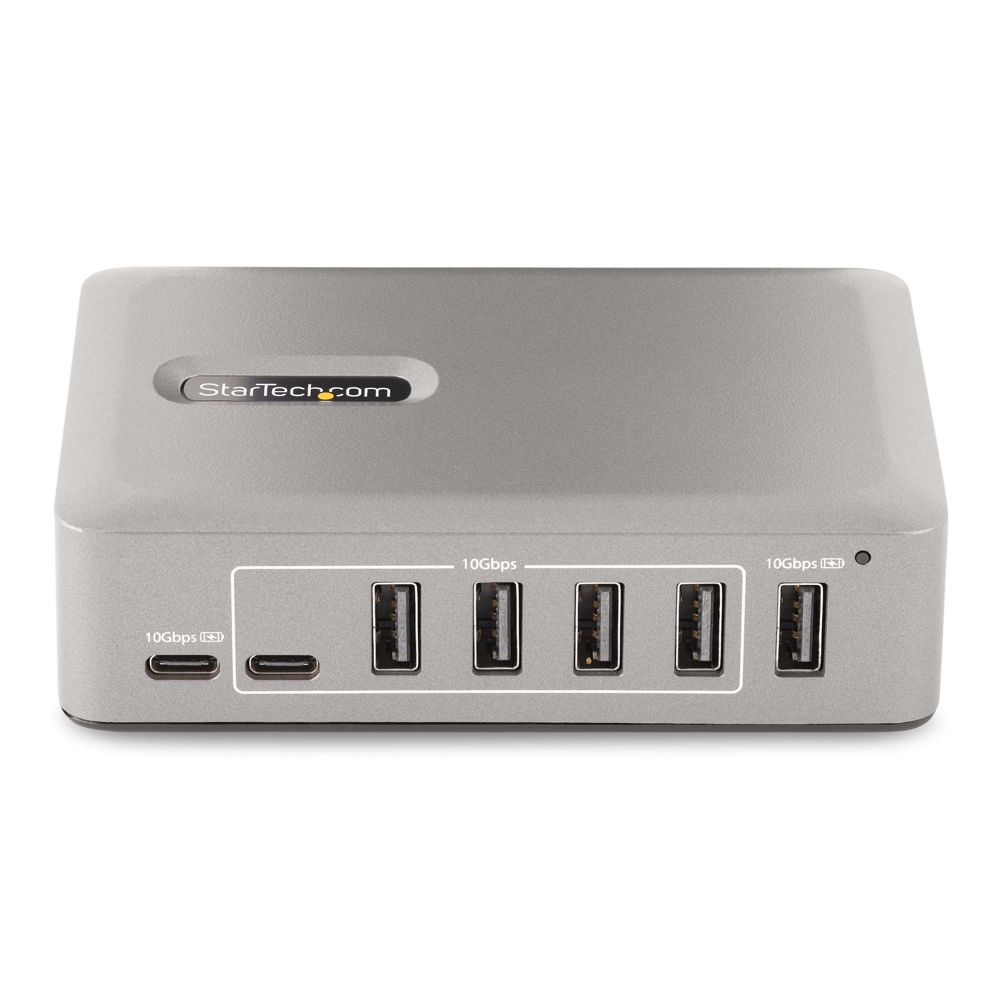 Silberner USB-Hub mit mehreren Anschlüssen, darunter USB-C und USB-A. 'StarTech.com' Logo sichtbar.